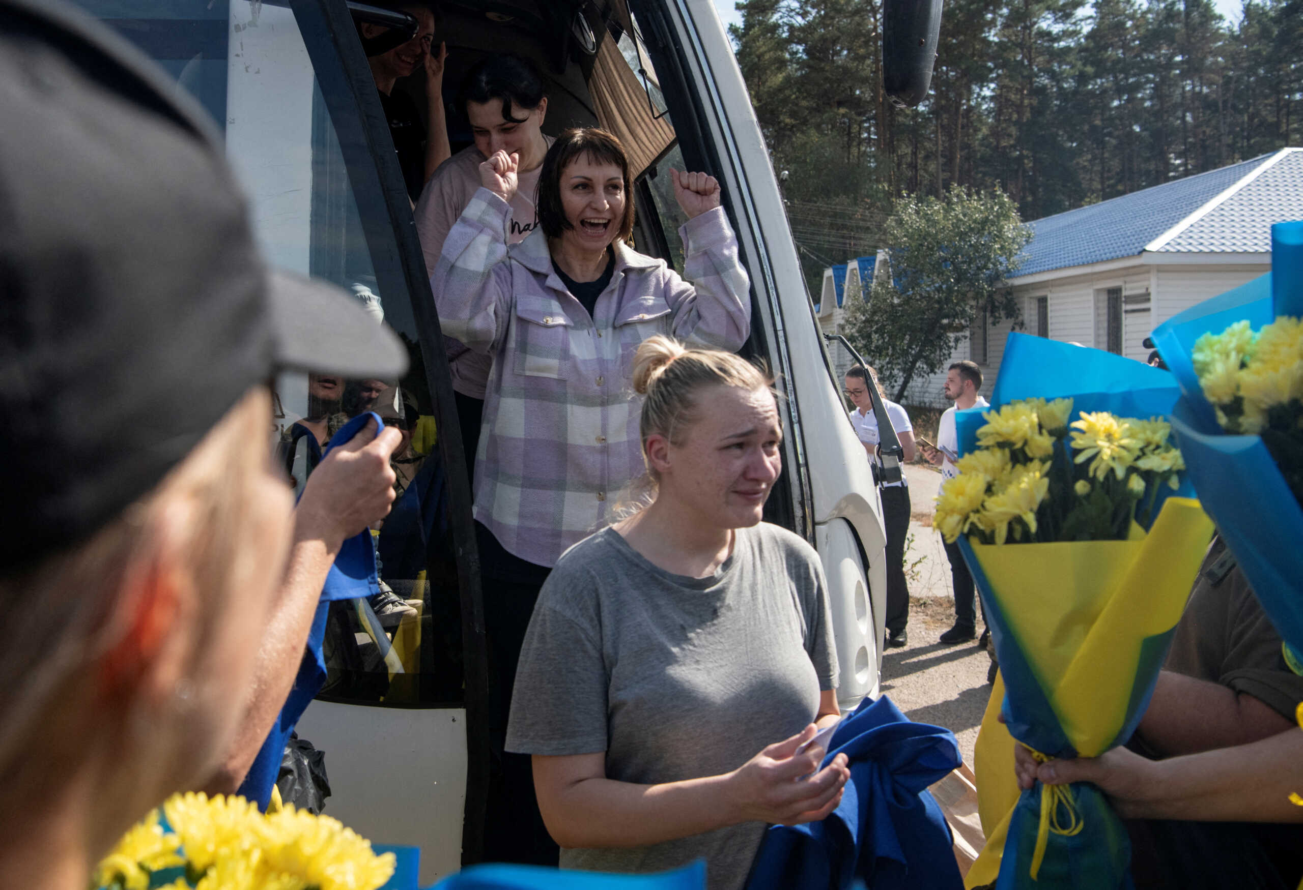 Ukrainian prisoners of war (POWs) react after a swap, amid Russia's attack on Ukraine, at an unknown location in Ukraine September 13, 2024. REUTERS