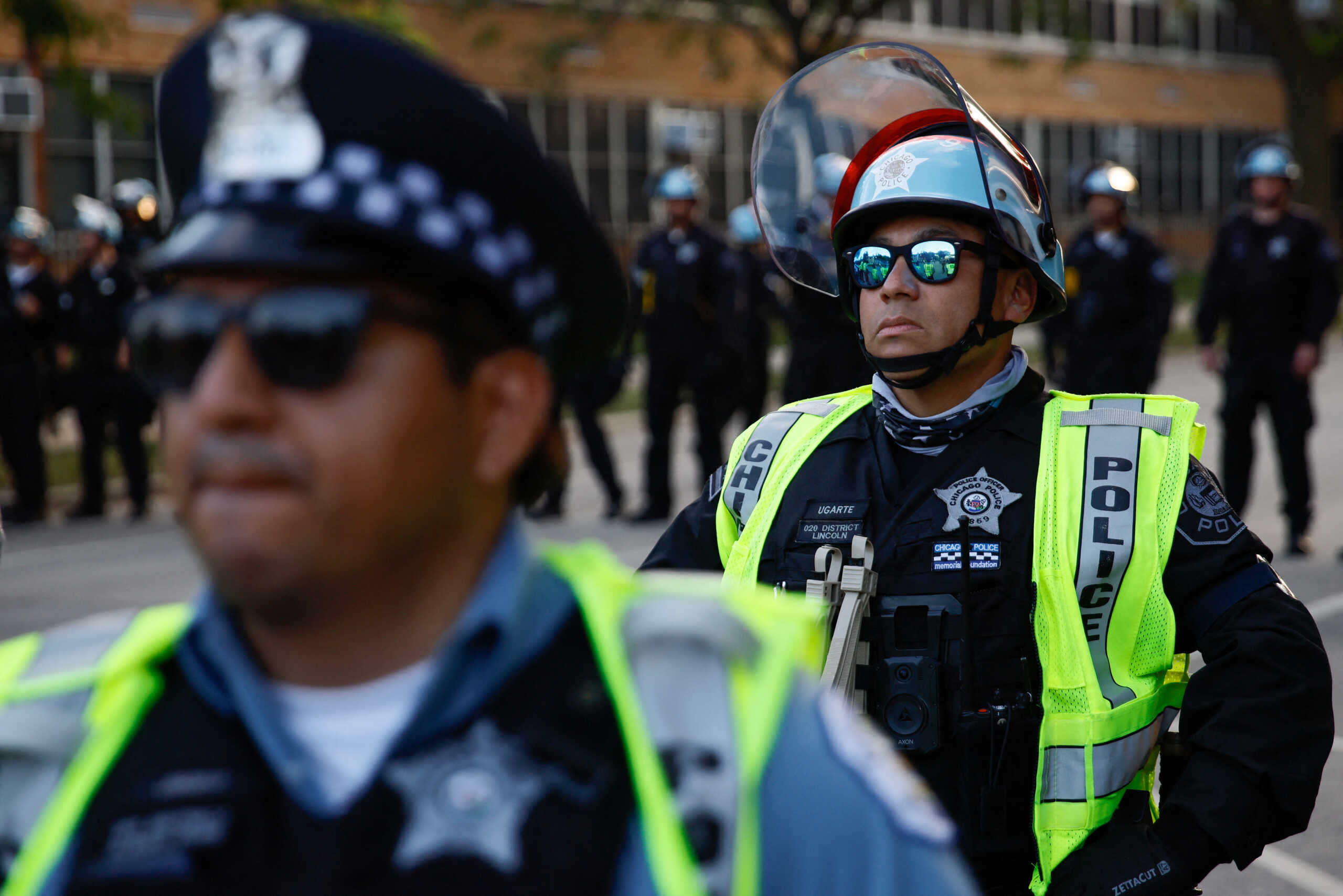 Police officers block a street as people take part in a protest organised by pro-abortion rights, pro-LGBT rights and pro-Palestinian activists, on the sidelines of the Democratic National Convention (DNC), in Chicago, Illinois, U.S., August 22, 2024. REUTERS
