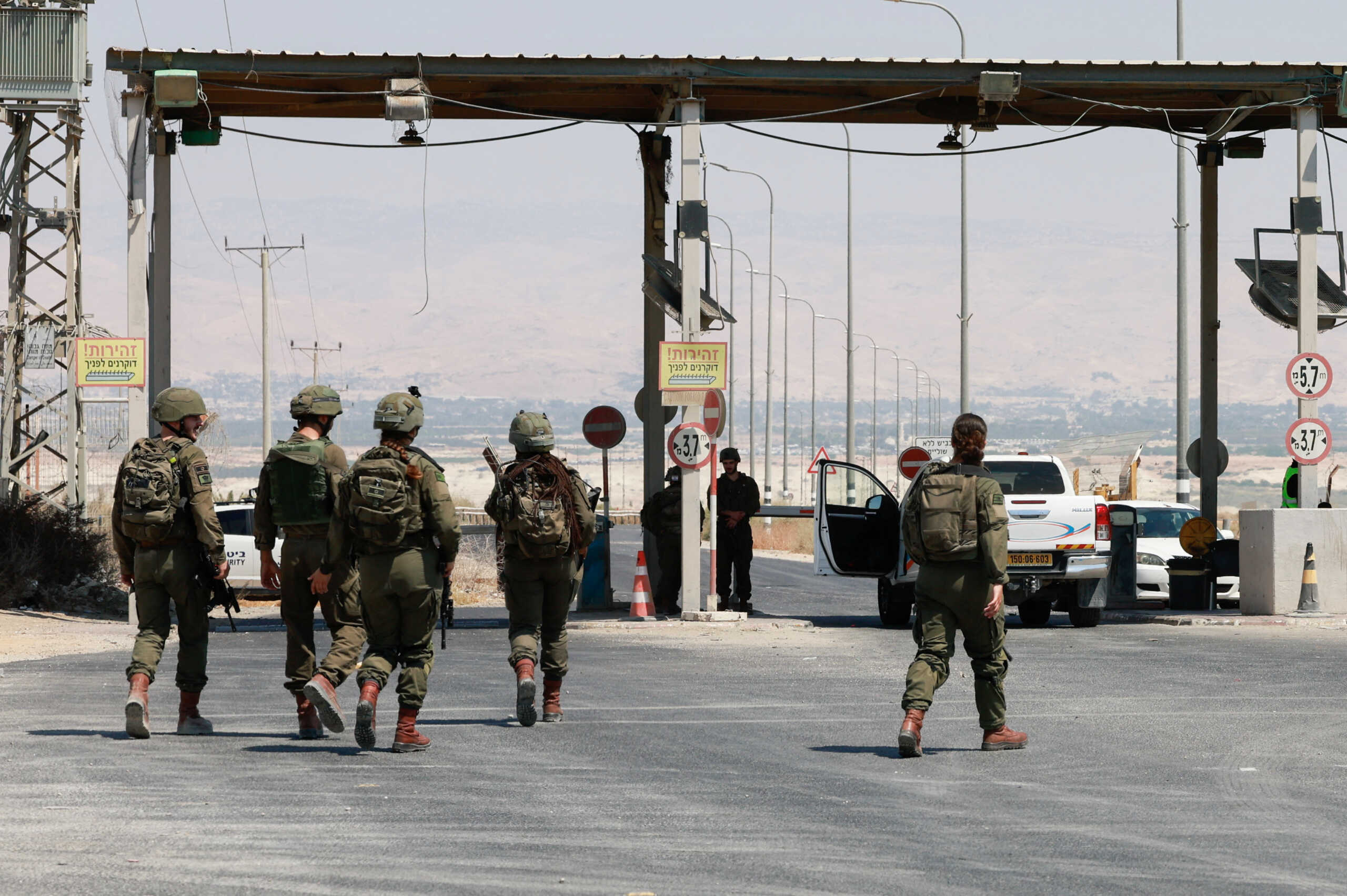 Israeli soldiers walk, at the Allenby Bridge Crossing between the West Bank and Jordan, following a shooting incident at the crossing in the Israeli-occupied West Bank, September 8, 2024. REUTERS