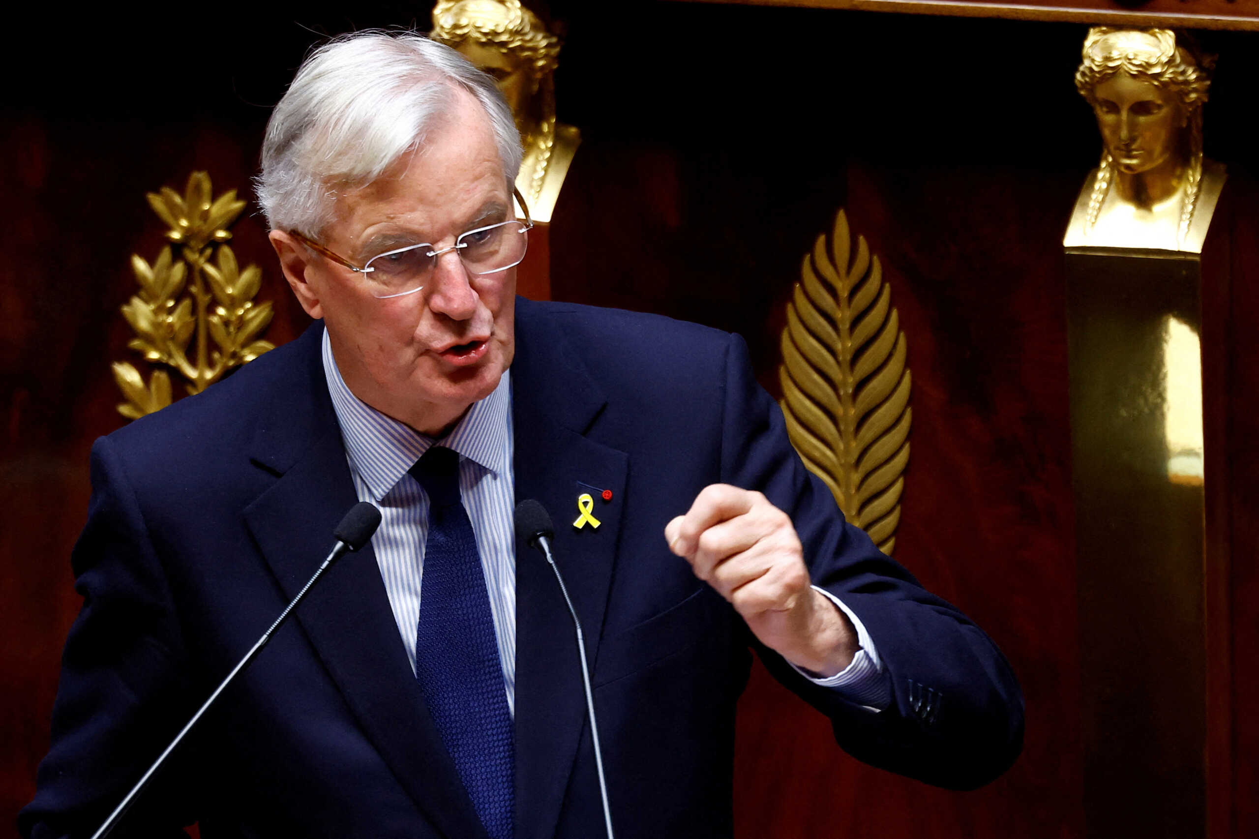 FILE PHOTO: French Prime Minister Michel Barnier delivers a speech during a censure motion debate filed by the alliance of left-wing parties the "Nouveau Front Populaire" (New Popular Front - NFP), after the questions to the government session at the National Assembly in Paris, France, October 8, 2024. REUTERS