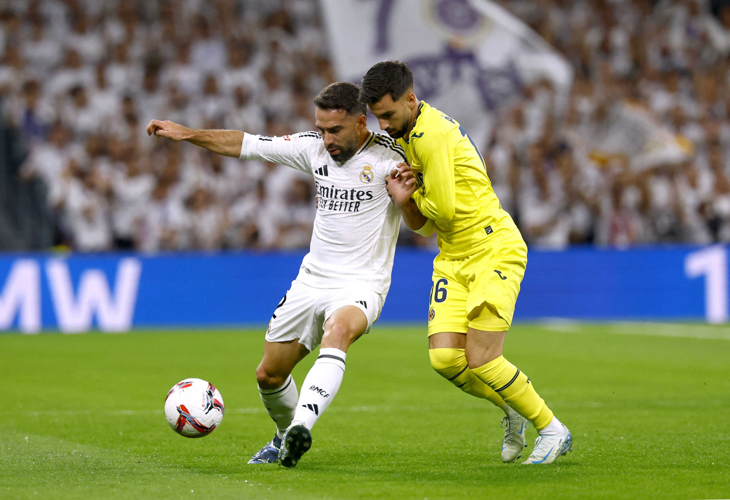 Soccer Football - LaLiga - Real Madrid v Villarreal - Santiago Bernabeu, Madrid, Spain - October 5, 2024 Real Madrid's Dani Carvajal in action with Villarreal's Alex Baena REUTERS