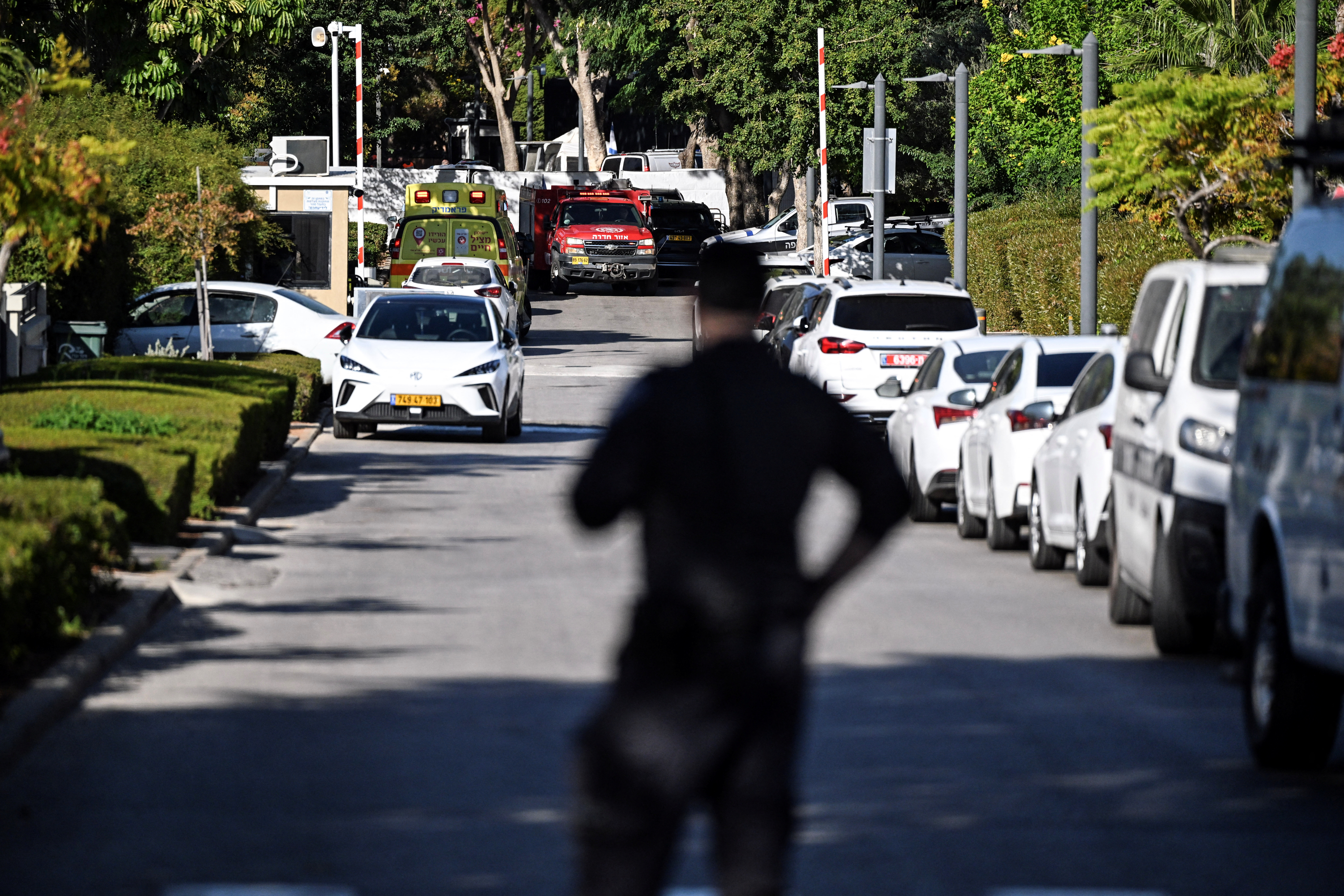 A member of Israeli security personnel stands at the entrance to a street, following a drone attack from Lebanon towards Israel amid ongoing hostilities between Hezbollah and Israel, in Caesarea, Israel, October 19, 2024 REUTERS