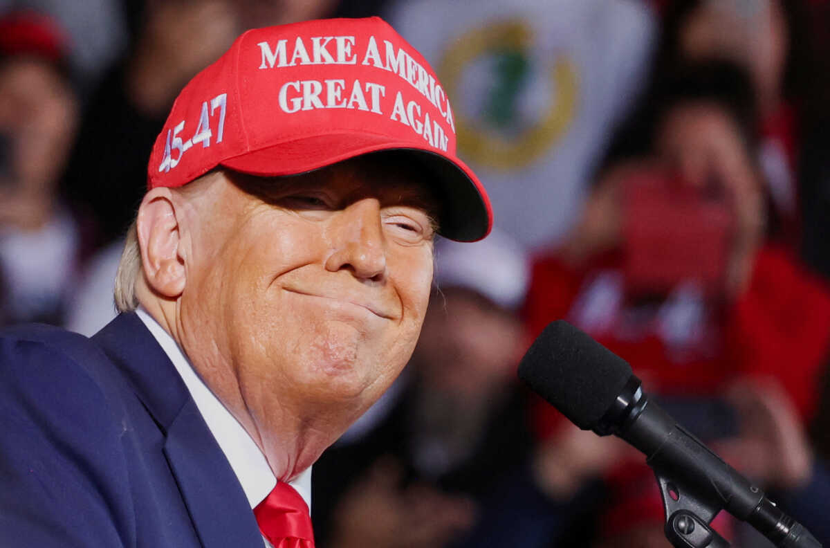Republican presidential nominee and former U.S. President Donald Trump smiles during a rally in Juneau, Wisconsin, U.S., October 6, 2024. REUTERS