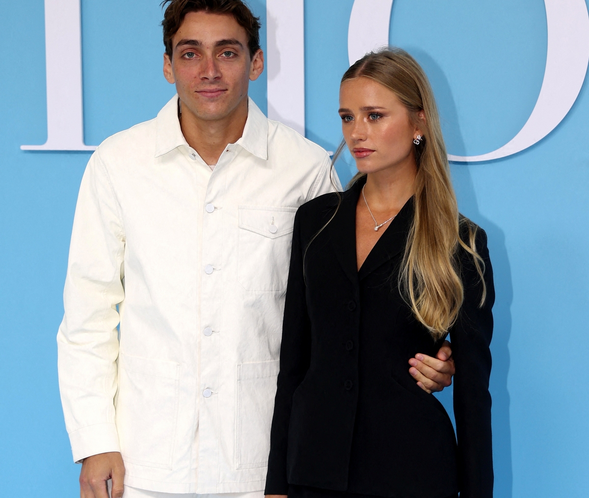 Armand Duplantis and his partner Desire Inglander pose during a photocall before Dior Spring