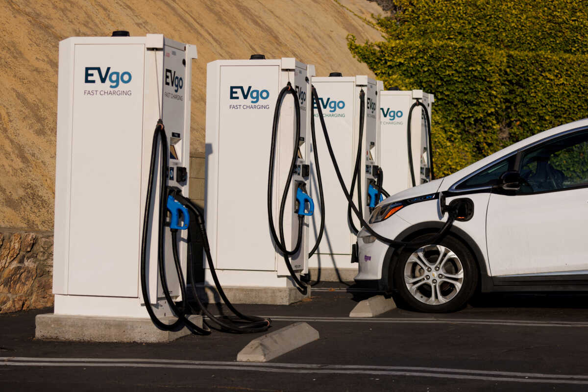 FILE PHOTO: EVGO Inc. Fast electric vehicle chargers are shown charging a Chevy Bolt in Encintas, California, U.S.,October 17, 2023.     REUTERS