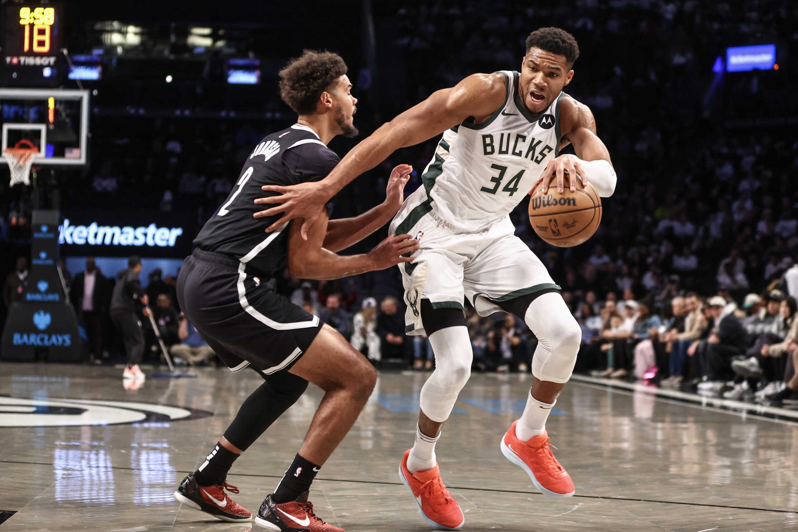 Oct 27, 2024; Brooklyn, New York, USA;  Milwaukee Bucks forward Giannis Antetokounmpo (34) looks to drive past Brooklyn Nets forward Cameron Johnson (2) in the first quarter at Barclays Center. Mandatory Credit: Wendell Cruz-Imagn Images