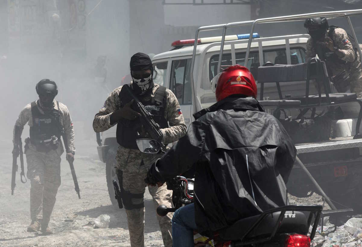 FILE PHOTO: Police officers patrol after dispersing demonstrators, who were calling for help from the government and security forces after gangs attacked neighbourhoods and set houses on fire, in Port-au-Prince, Haiti August 19, 2024. REUTERS