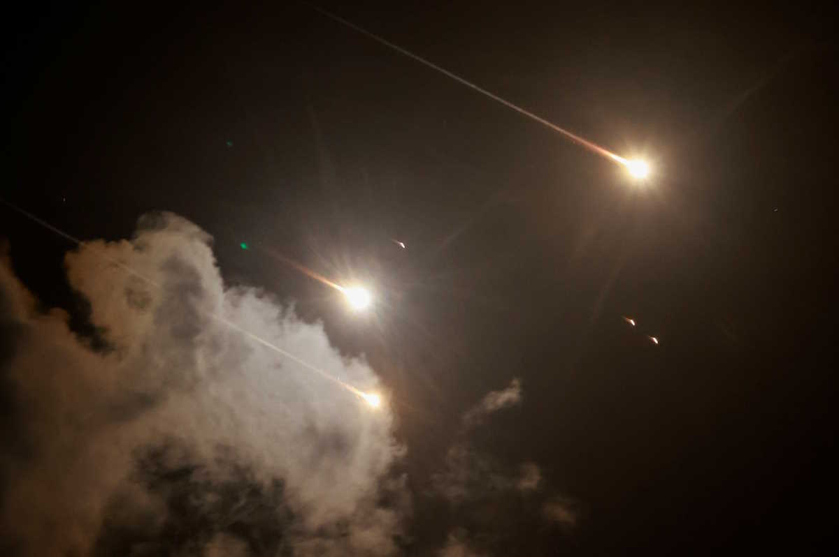 Projectiles are seen in the sky after Iran fired a salvo of ballistic missiles, amid cross-border hostilities between Hezbollah and Israel, as seen from Tel Aviv, Israel, October 1, 2024. REUTERS