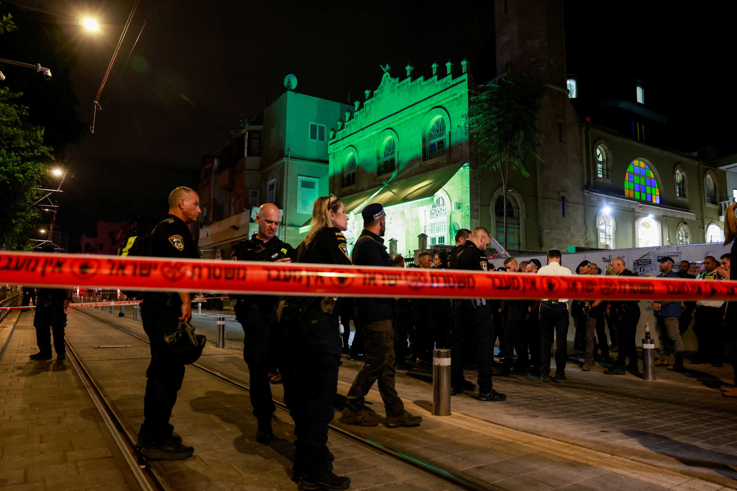 Israeli forces stand near the scene of a shooting attack in Jaffa, Israel, October 1, 2024. REUTERS