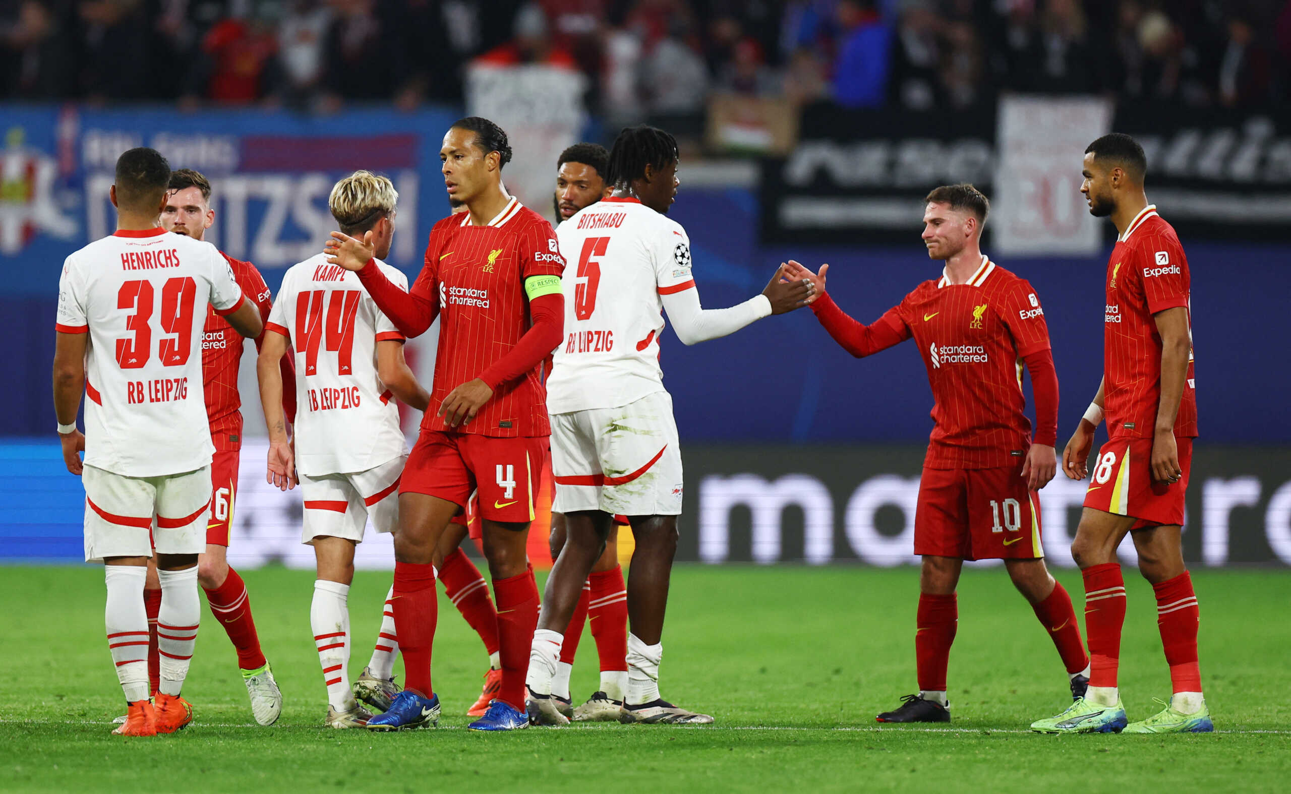 Soccer Football - Champions League - RB Leipzig v Liverpool - Red Bull Arena, Leipzig, Germany - October 23, 2024 RB Leipzig's El Chadaille Bitshiabu shakes hands with Liverpool's Alexis Mac Allister after the match REUTERS