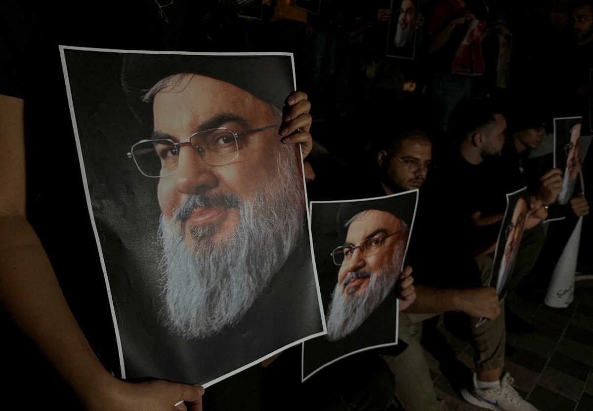 Supporters of Lebanon's Hezbollah leader Sayyed Hassan Nasrallah carry his pictures as they gather in Sidon, following his killing in an Israeli airstrike in Beirut's southern suburbs on Friday, Lebanon September 28, 2024. REUTERS