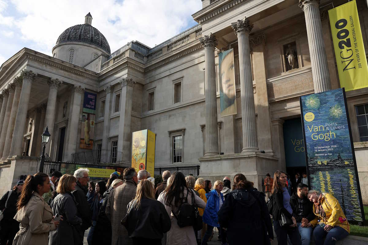People stand outside The National Gallery, after activists from Just Stop Oil threw soup at Vincent van Gogh's "Sunflowers" paintings, on the day of the sentencing for the same action done in October 2022 for Phoebe Plummer and Anna Holland, in London, Britain, September 27, 2024. REUTERS