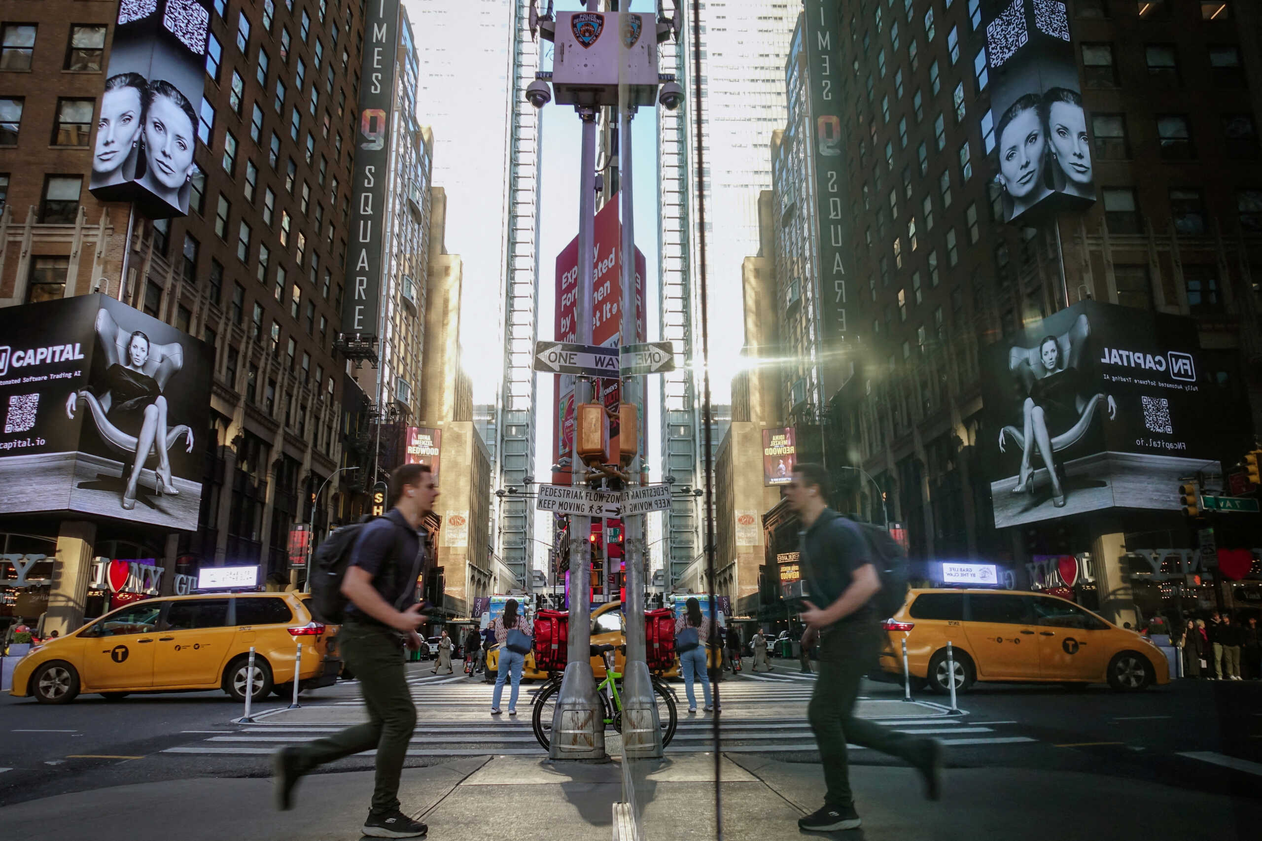 People make their way through the streets of Manhattan at the start of a work day in New York, U.S., October 30, 2024. REUTERS