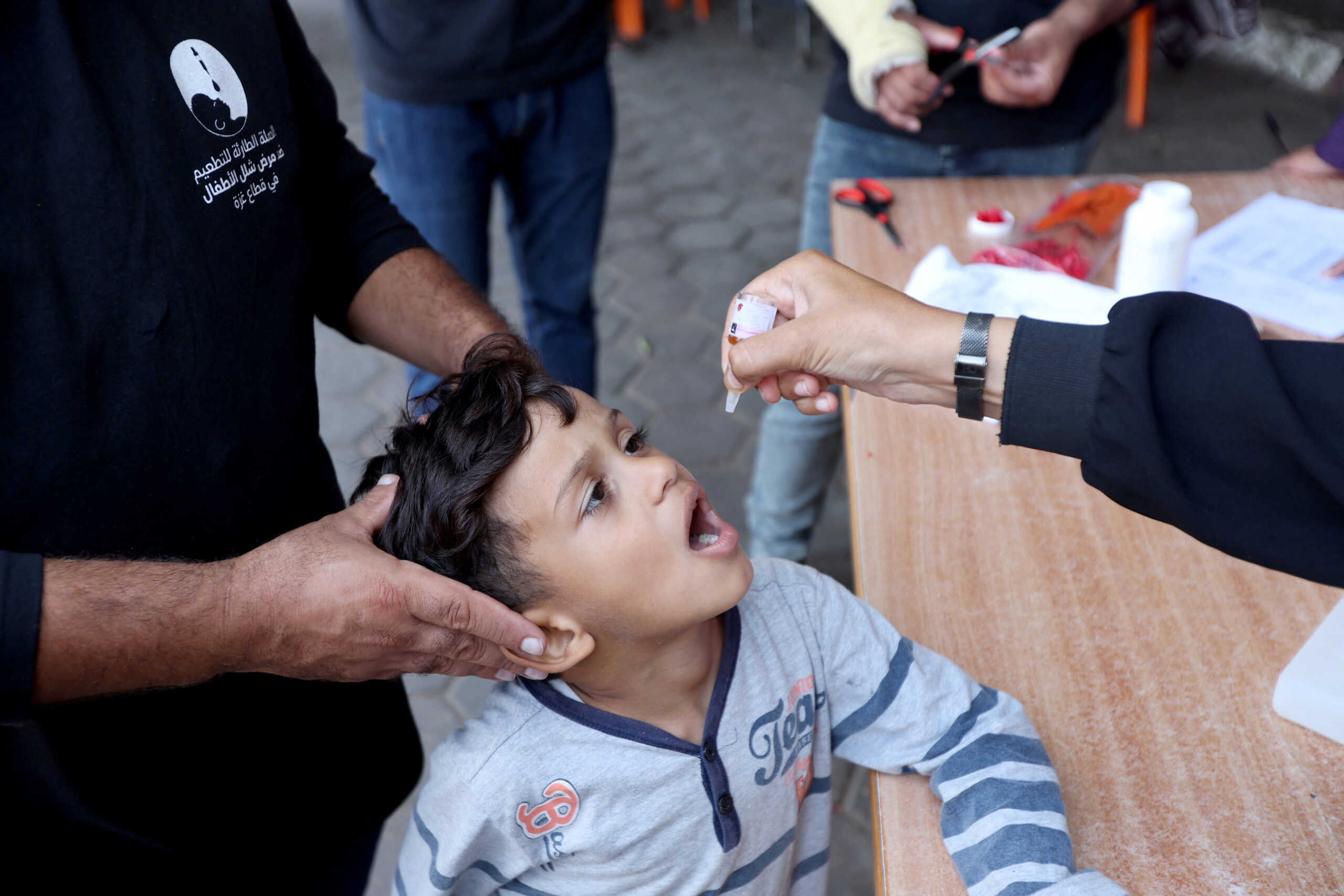 Palestinian child is vaccinated against polio during the second round of a vaccination campaign, amid the Israel-Hamas conflict, in Deir Al-Balah in the central Gaza Strip, October 14, 2024. REUTERS