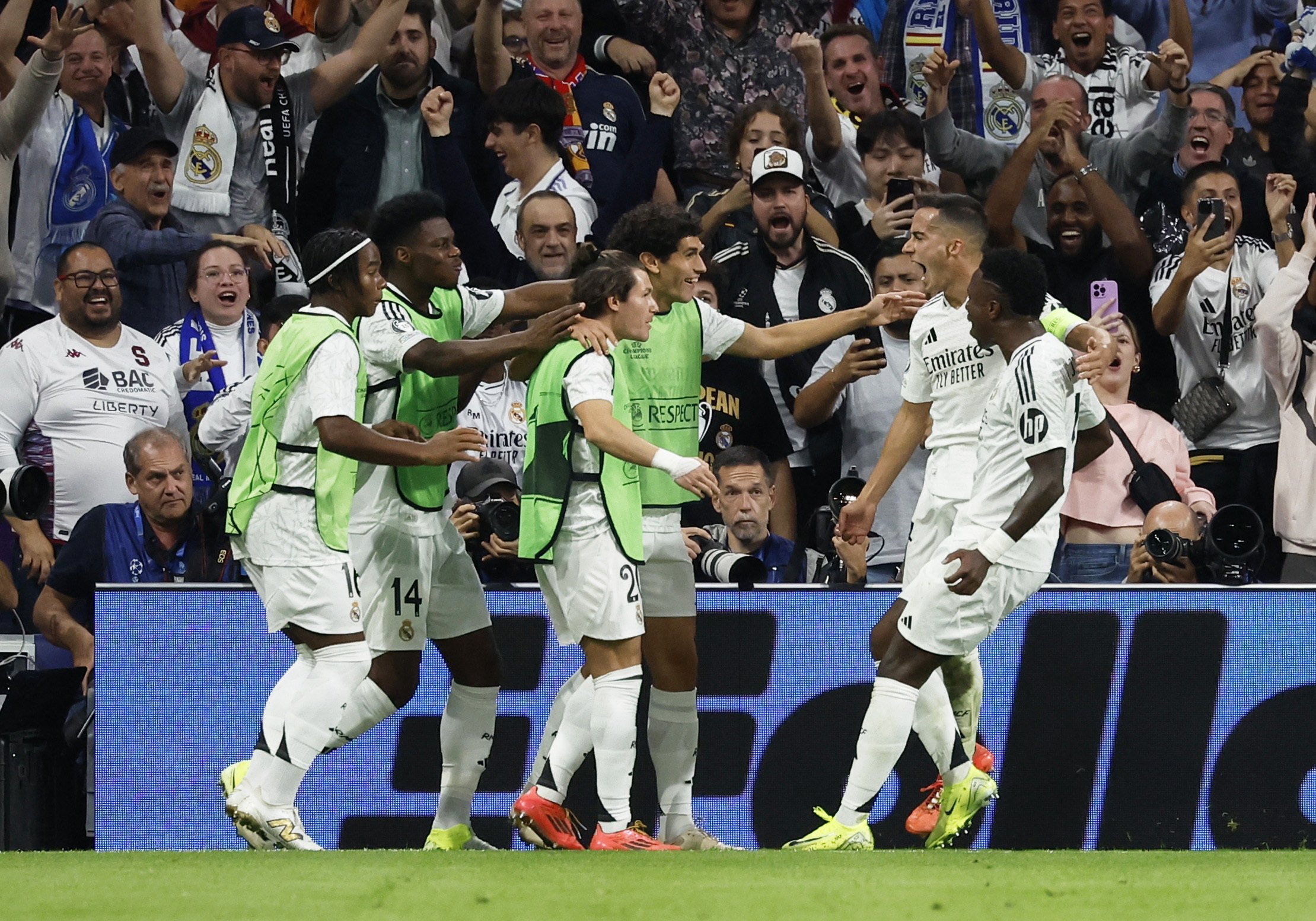 Soccer Football - Champions League - Real Madrid v Borussia Dortmund - Santiago Bernabeu, Madrid, Spain - October 22, 2024 Real Madrid's Lucas Vazquez celebrates scoring their third goal with teammates REUTERS