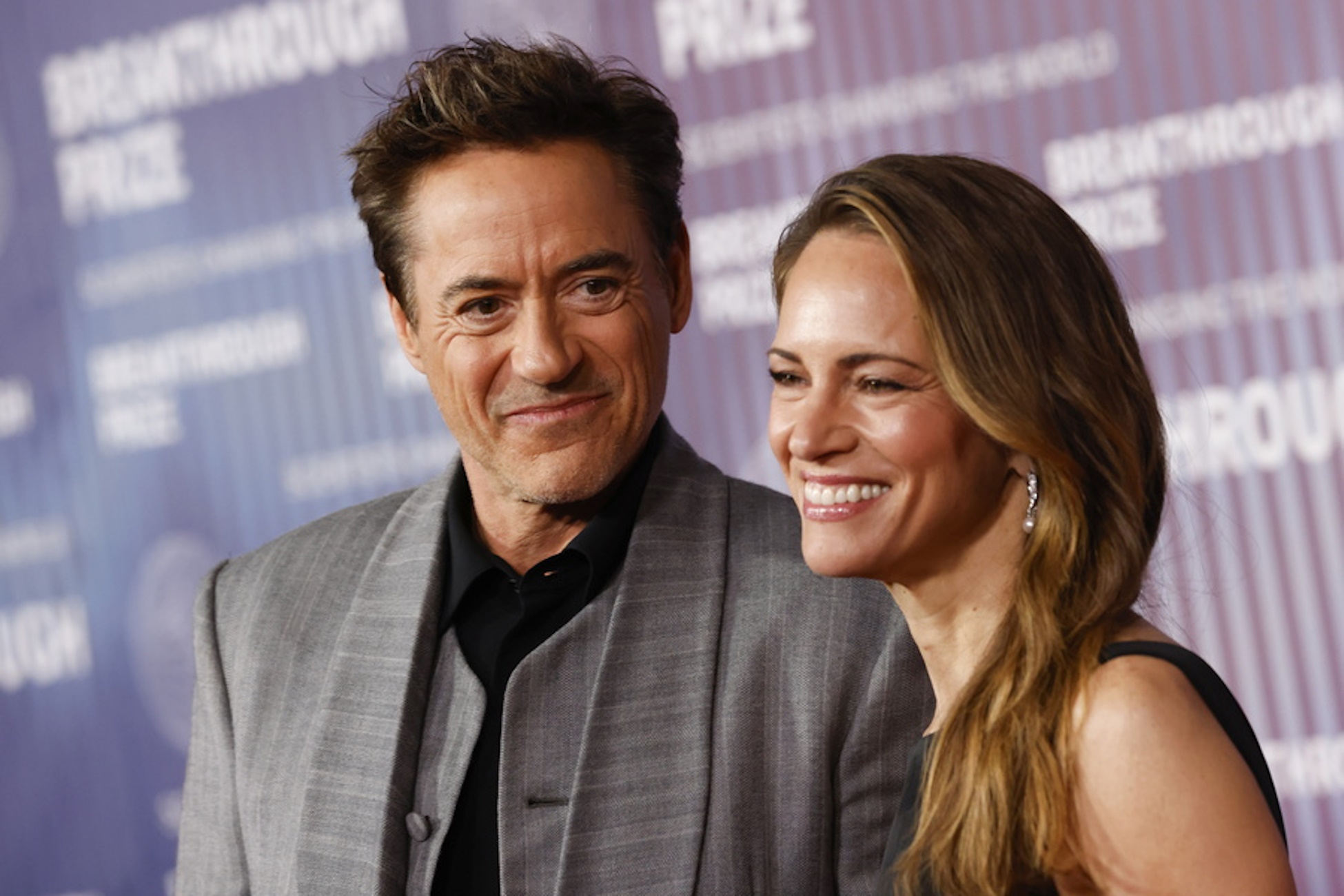 epa11277790 US producer Susan Downey (R) and US actor Robert Downey Jr. (L) attend the tenth Breakthrough Prize Ceremony at the Academy Museum of Motion Pictures in Los Angeles, California, USA, 13 April 2024. The gala honors acclaimed science and mathematics luminaries  with leading figures from the worlds of entertainment, technology, sports and business.  EPA