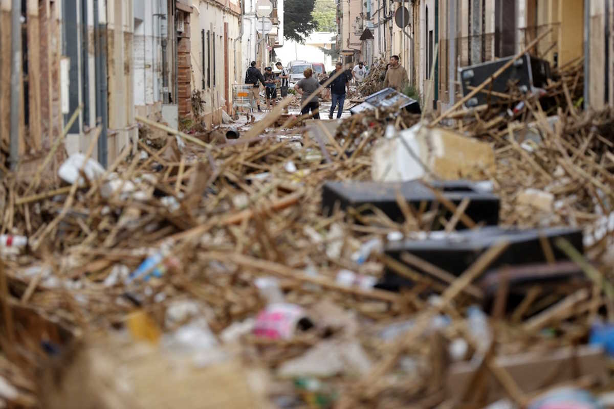 epa11692841 Residents check the damage in the flood-hit municipality of Paiporta, in the province of Valencia, Spain, 30 October 2024. The intense rainfall impacting the eastern part of the country resulted in at least 70 lives being lost in the province of Valencia and neighboring provinces due to the flooding. The mayor of Paiporta, located about ten kilometers southwest of Valencia, confirmed that at least 34 people died in the municipality due to the flooding. The State Meteorological Agency (AEMET) issued orange and red alerts for rainfall in multiple regions of east and southern Spain due to a DANA (isolated depression at high levels) phenomenon.  EPA