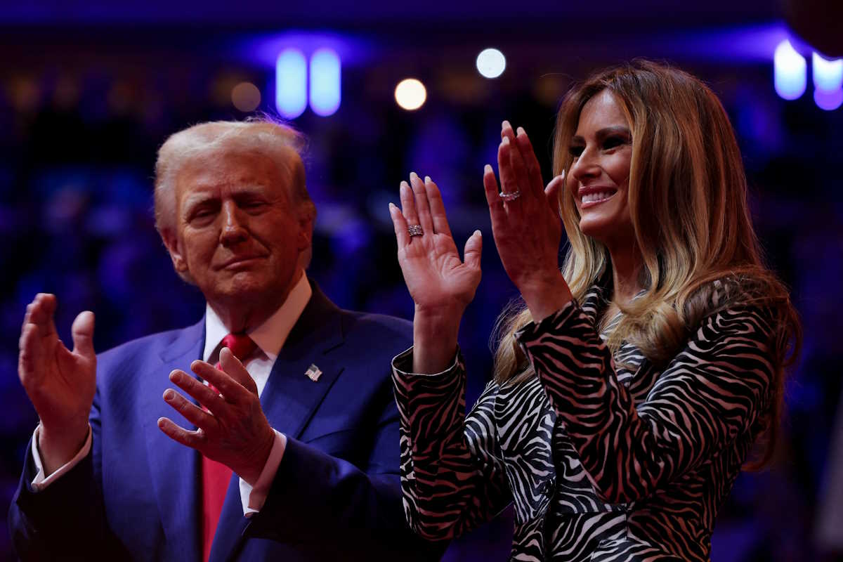 Republican presidential nominee and former U.S. President Donald Trump claps hands on stage next to Melania Trump during a rally at Madison Square Garden, in New York, U.S., October 27, 2024. REUTERS