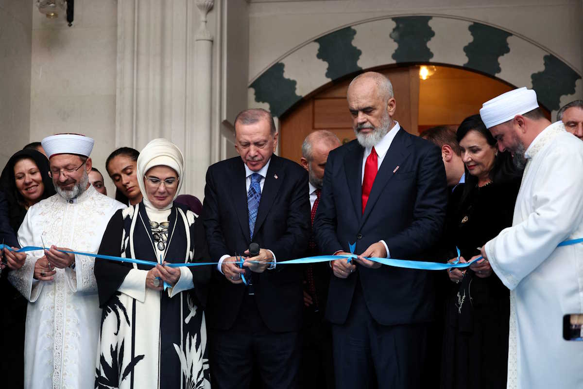 Turkish President Tayyip Erdogan, his wife Emine Erdogan and Albania's Prime Minister Edi Rama cut the ribbon, during the inauguration of The Great Mosque of Tirana or Namazgah Mosque, the largest mosque in the Balkans, in Tirana, Albania October 10, 2024. REUTERS