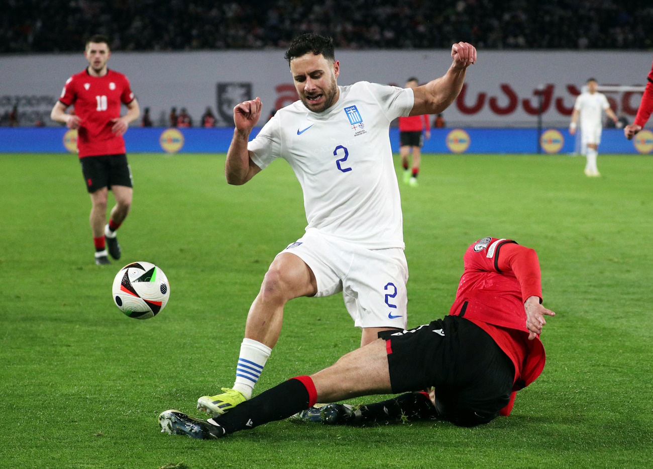 FILE PHOTO: Soccer Football - Euro 2024 Qualifier - Playoff - Georgia v Greece - Boris Paichadze Dinamo Arena, Tbilisi, Georgia - March 26, 2024 Greece's George Baldock in action with Georgia's Lasha Dvali REUTERS