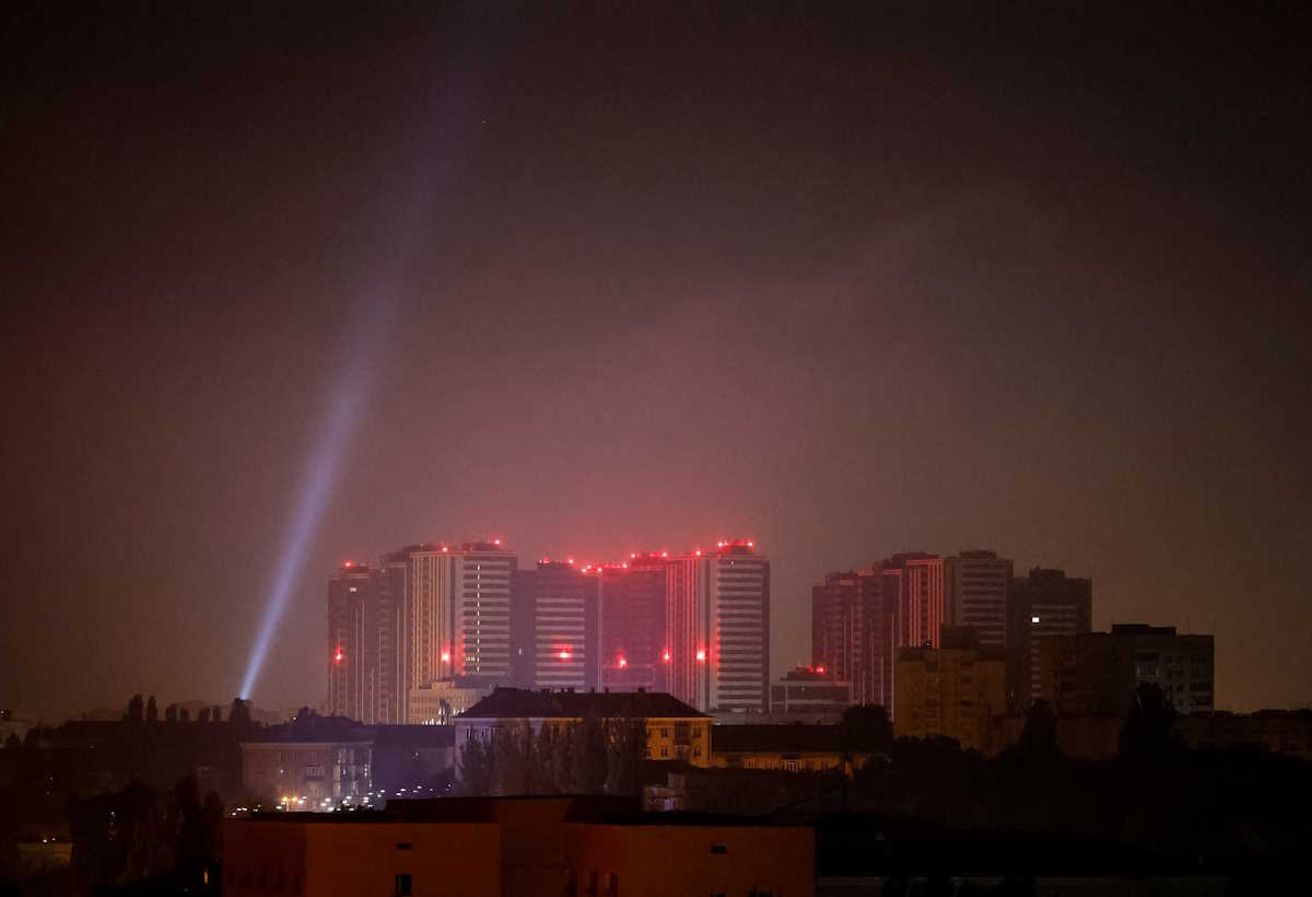 Ukrainian service personnel use searchlight as they search for drones in the sky over the city centre during a Russian drone strike, amid Russia's attack on Ukraine, in Kyiv, Ukraine October 11, 2024. REUTERS