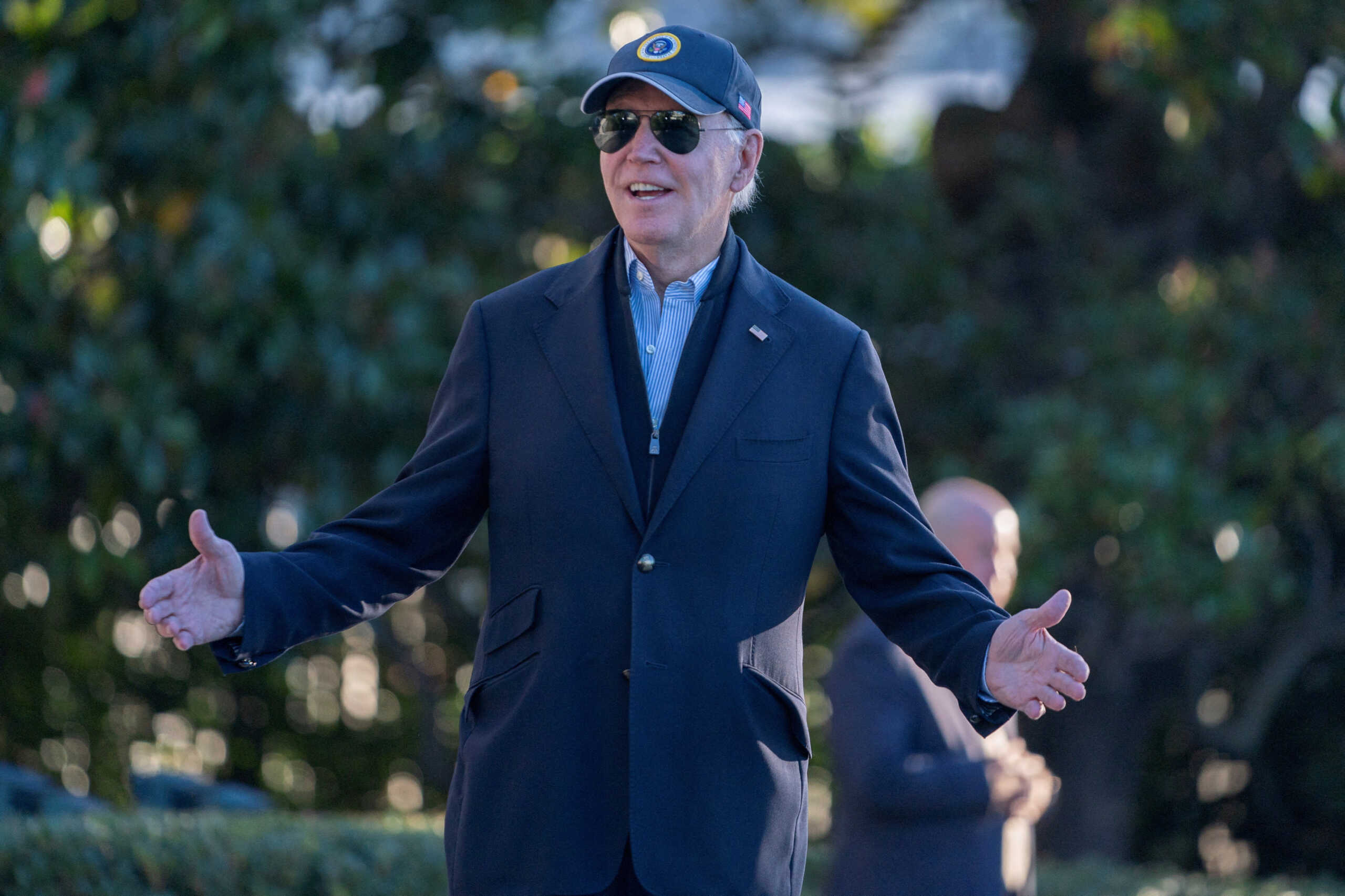 FILE PHOTO: U.S. President Joe Biden speaks to members of the media while departing for Berlin, Germany from the South Lawn of the White House in Washington, U.S., October 17, 2024. REUTERS