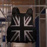 epa08759613 A customised stab-proof vest, designed by street artist Banksy and worn by British musician Stormzy during his performance at the Glastonbury Festival in 2019, is on display during a preview of the 'Beazley Designs of the Year' exhibition at the Design Museum in London, Britain, 20 October 2020.  EPA