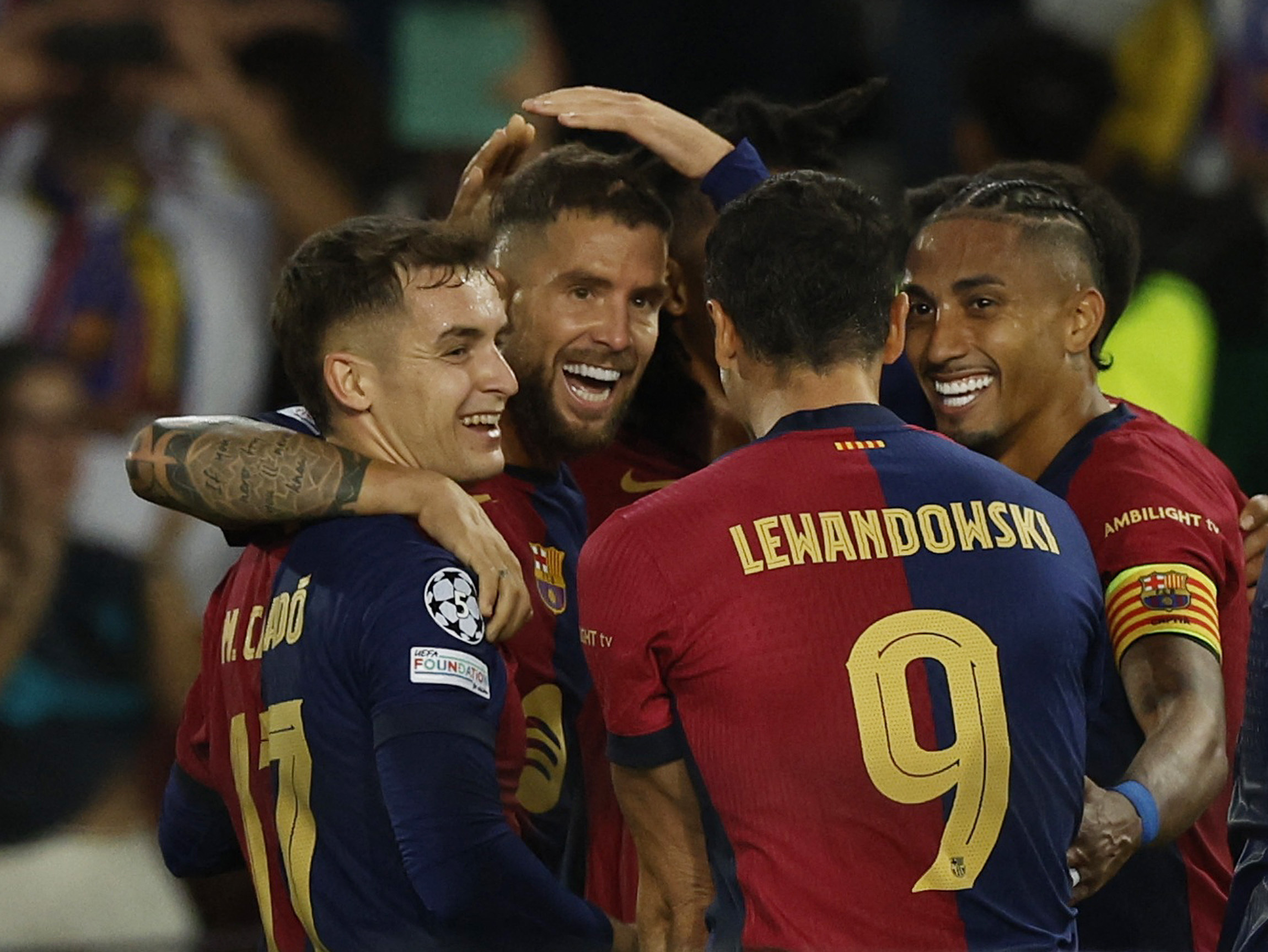 Soccer Football - Champions League - FC Barcelona v BSC Young Boys - Estadi Olimpic Lluis Companys, Barcelona, Spain - October 1, 2024 FC Barcelona's Inigo Martinez celebrates scoring their third goal with Robert Lewandowski, Raphinha and Marc Casado REUTERS
