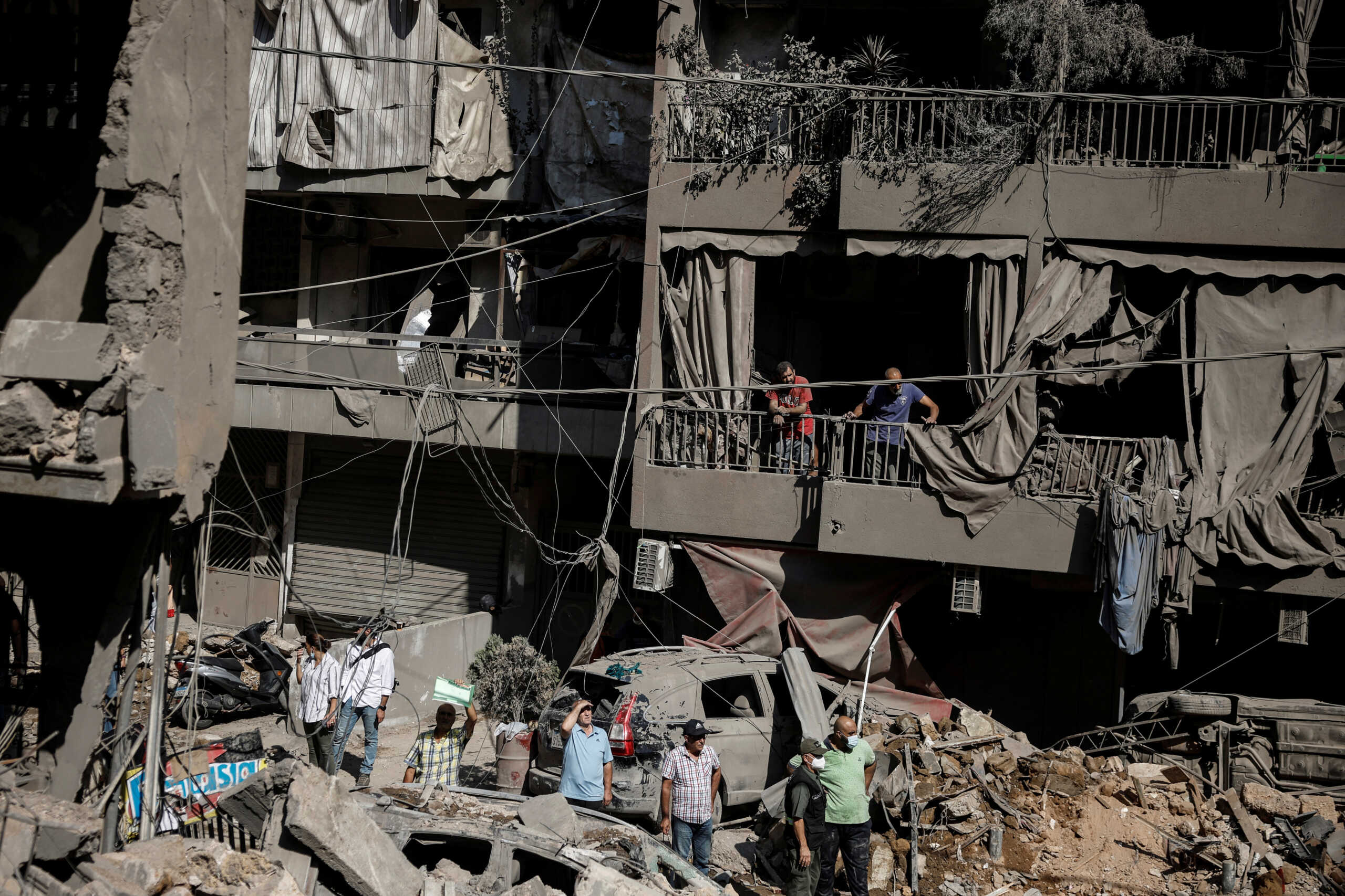 People look at the damage at the site of an Israeli air strike, amid ongoing hostilities between Hezbollah and Israeli forces, in Beirut, Lebanon, October 11, 2024. REUTERS