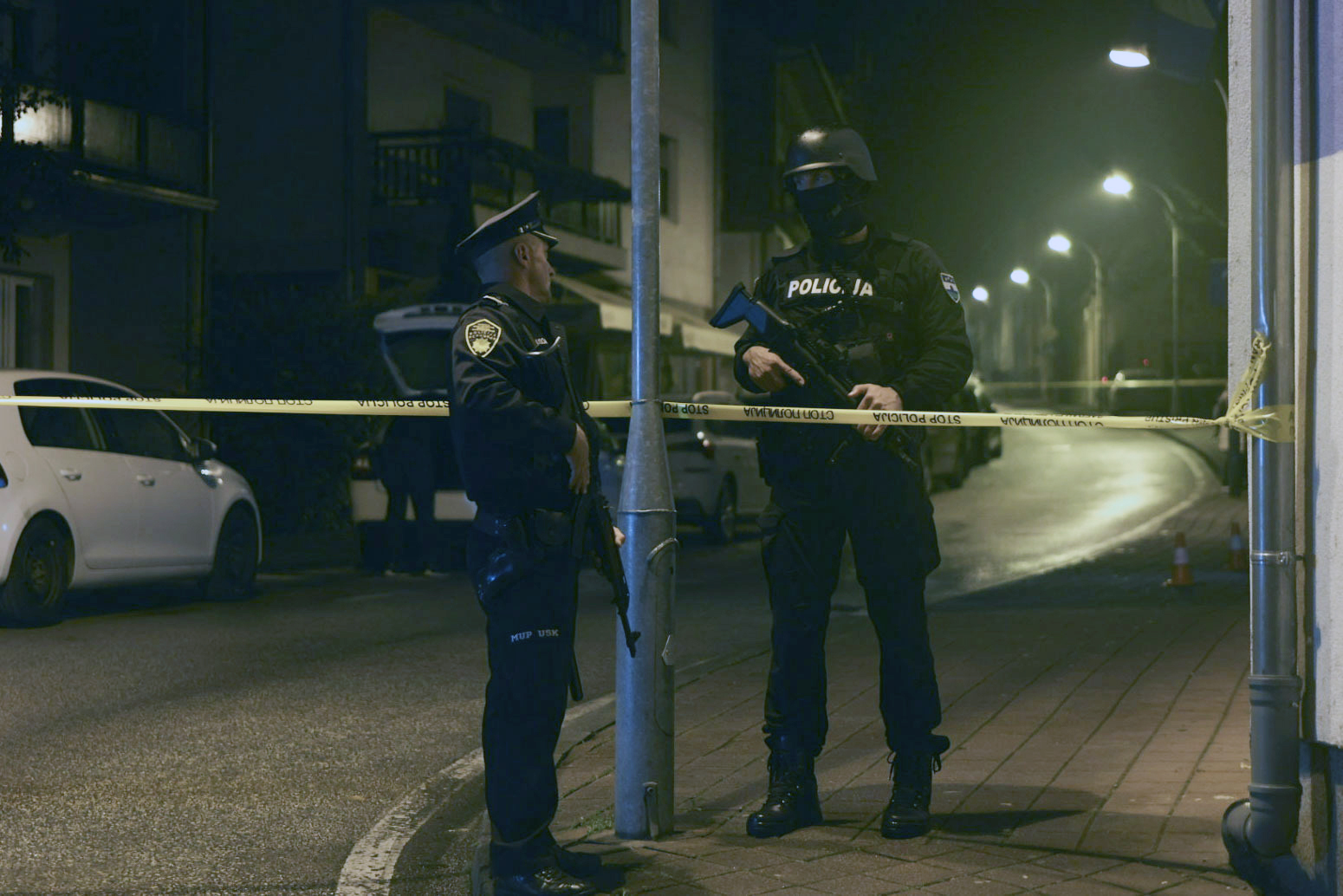 Bosnian police officer guard the local police station after a teenager broke and killed one officer with a knife and wounded another, in the town of Bosanska Krupa, 200 kilometers (120 miles) northwest of Bosnia's capital Sarajevo, Thursday, Oct. 24, 2024. (AP Photo