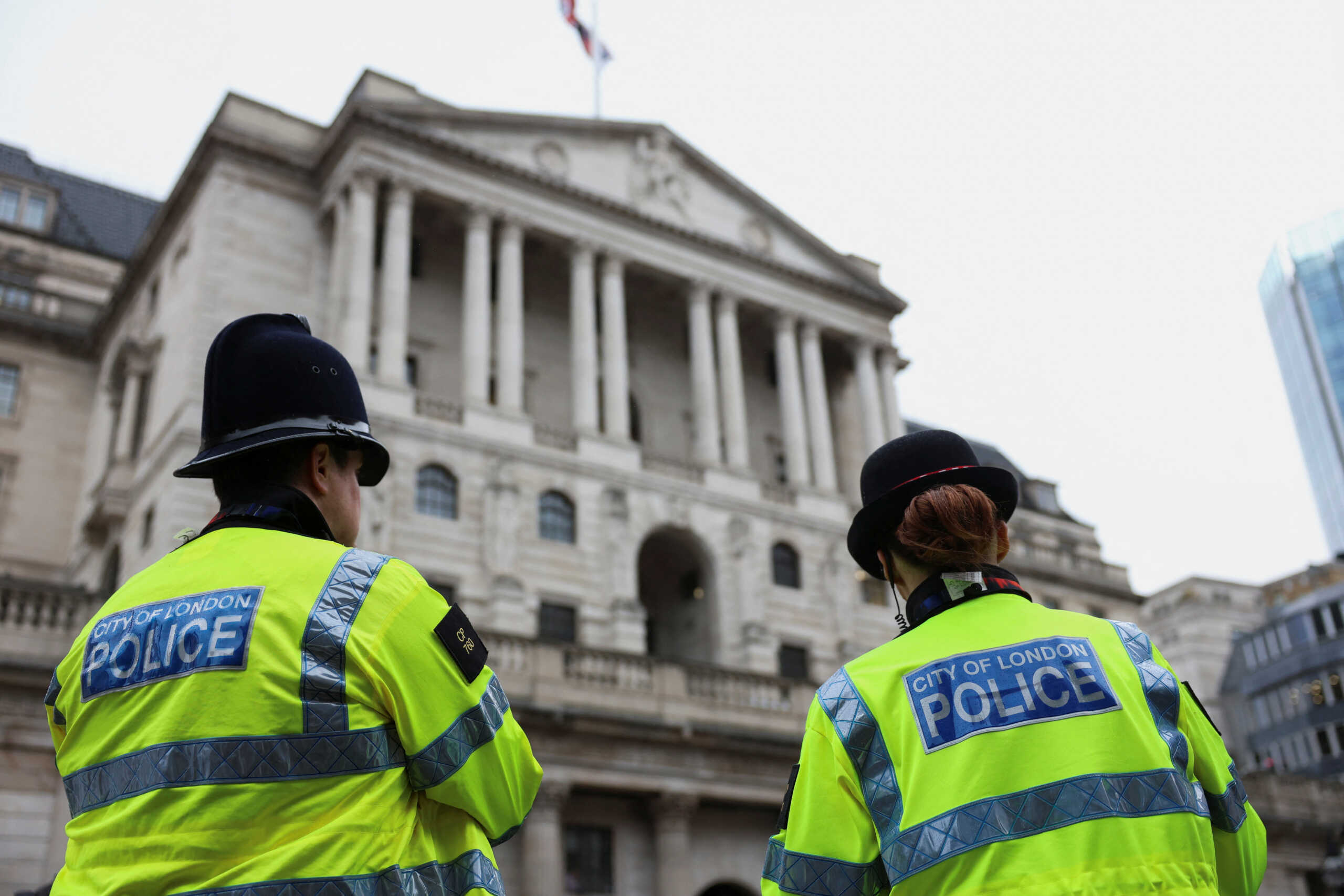 Police stand in front of the Bank of England as Extinction Rebellion activists protest, in London, Britain, October 28, 2024. REUTERS