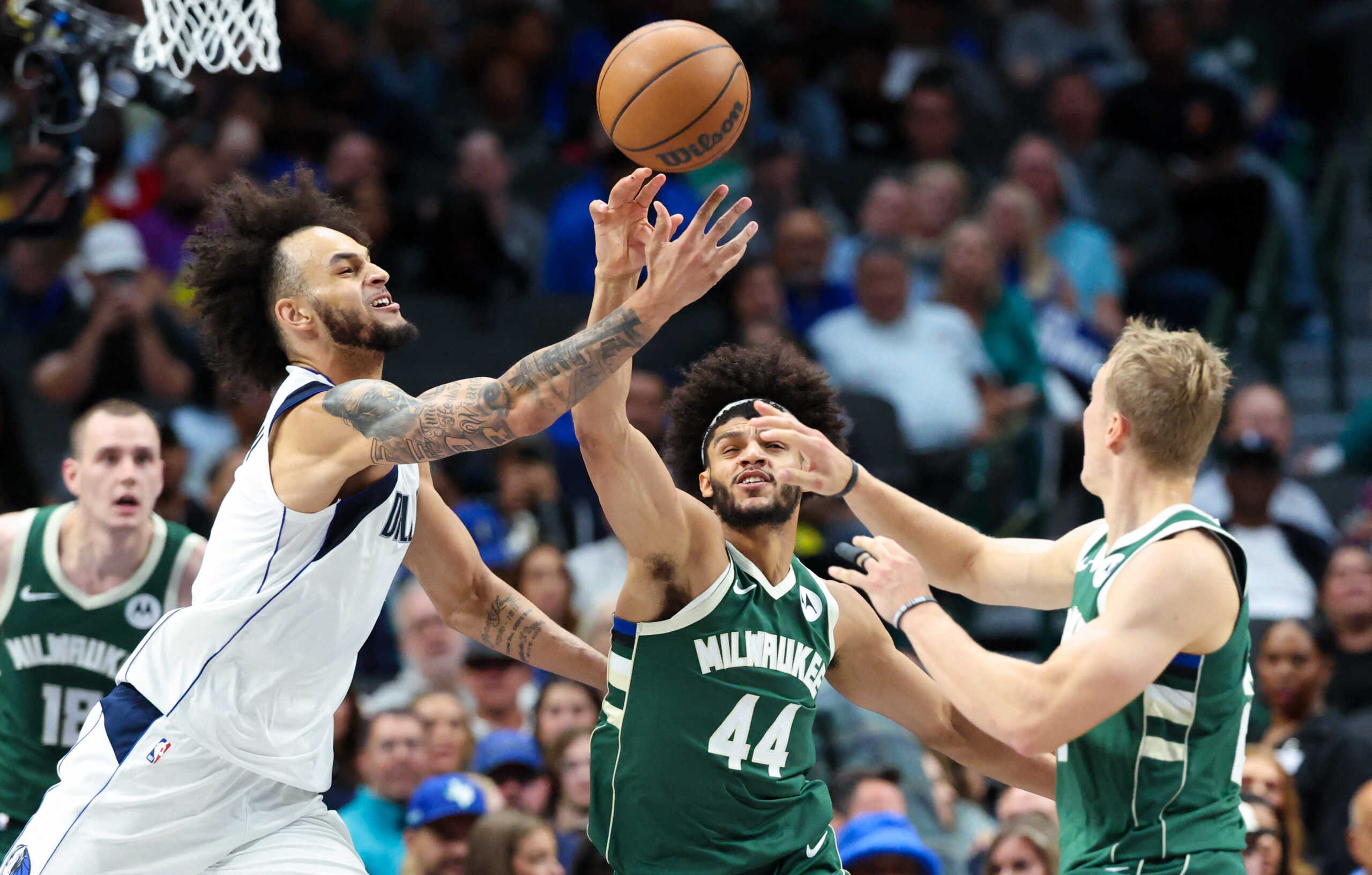 Oct 17, 2024; Dallas, Texas, USA;  Dallas Mavericks center Dereck Lively II (2) and Milwaukee Bucks guard Andre Jackson Jr. (44) go for a loose ball during the second half at American Airlines Center. Mandatory Credit: Kevin Jairaj-Imagn Images