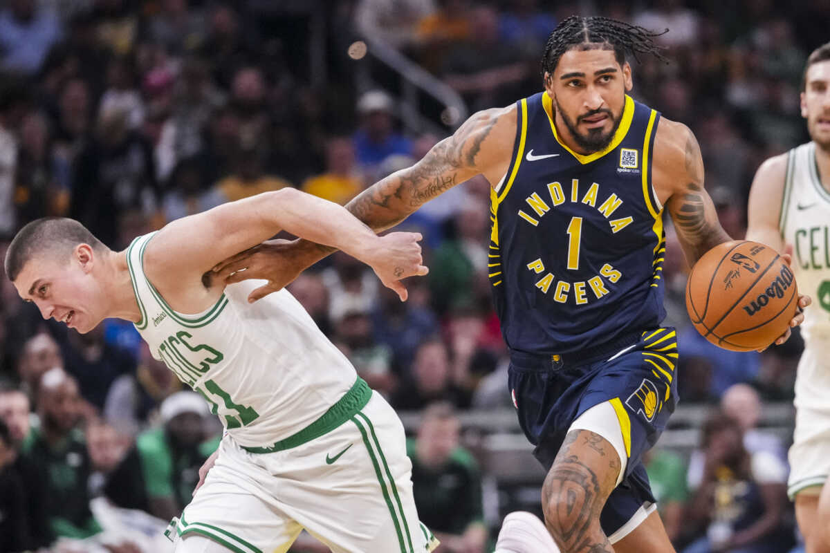 Oct 30, 2024; Indianapolis, Indiana, USA; Boston Celtics guard Payton Pritchard (11) grabs Indiana Pacers forward Obi Toppin (1) as he dribbles down the court at Gainbridge Fieldhouse. Mandatory Credit: Grace Smith-Imagn Images