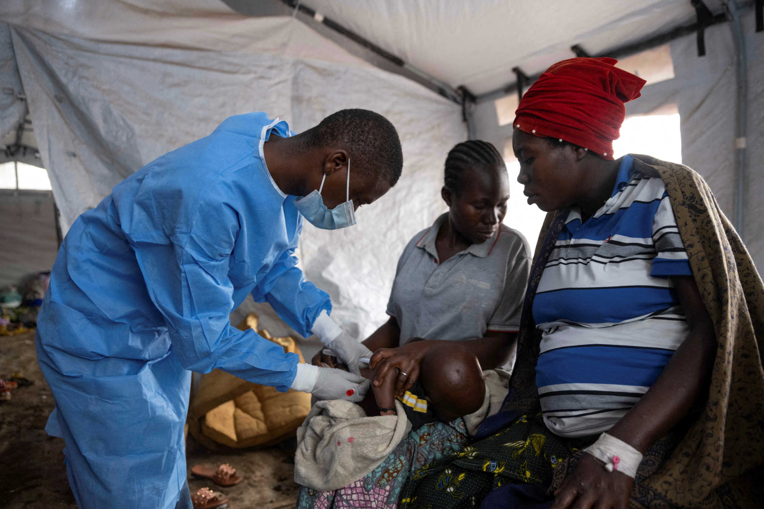 FILE PHOTO: A Congolese nurse takes a sample from a suspected mpox patient in the treatment centre at the Kavumu hospital in Kabare territory, South Kivu province of the Democratic Republic of Congo, August 29, 2024. REUTERS