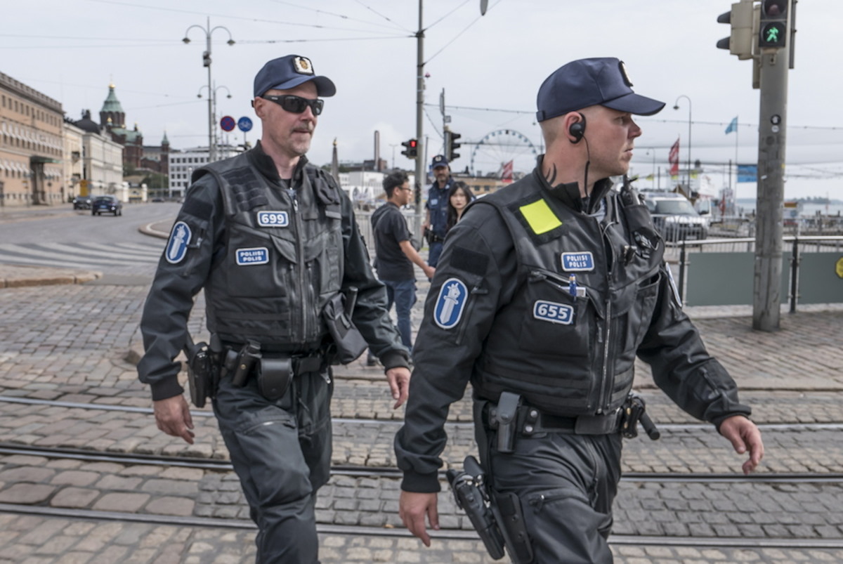 epa07784089 Finnish police walk around the closed Market Square preparing for the arrival of Russian President Putin in Helsinki, Finland, 21 August 2019.  EPA