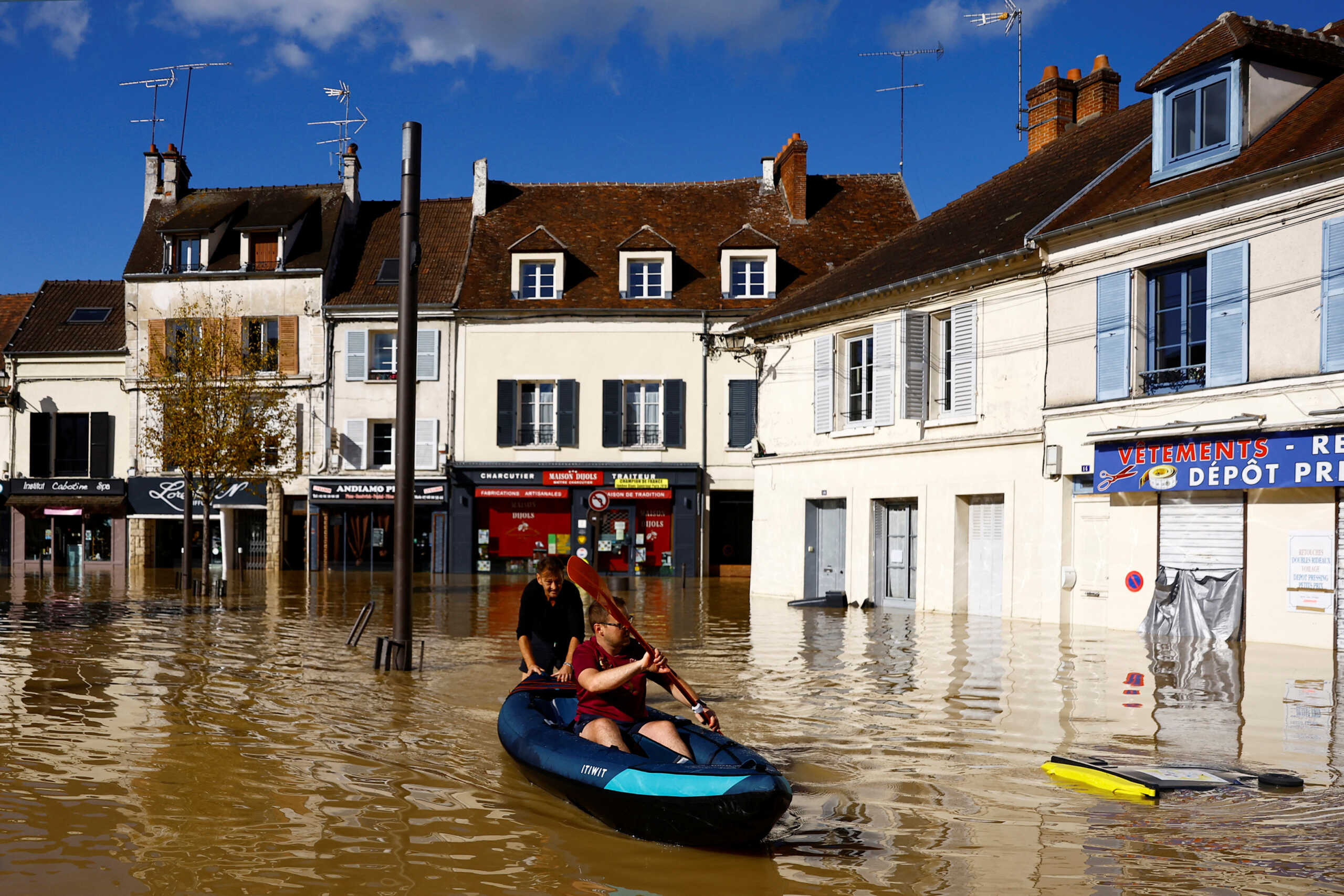 A man paddles a canoe on a flooded street in Crecy-la-Chapelle, Seine-et-Marne department, after heavy rain and the passage of the storm Kirk caused flooding over the country, France, October 11, 2024. REUTERS