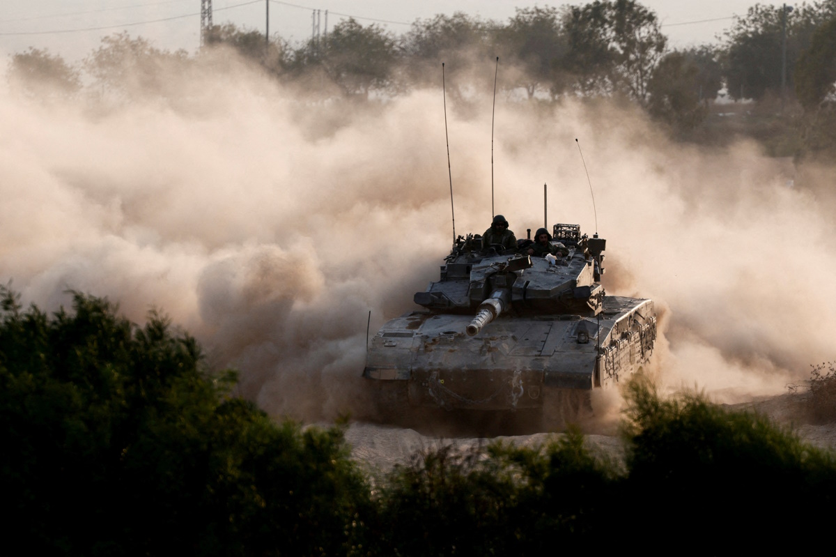 An Israeli tank manoeuvres near the Israel-Gaza border, amid the ongoing conflict between Israel and Hamas, as seen from Israel, October 15, 2024. REUTERS