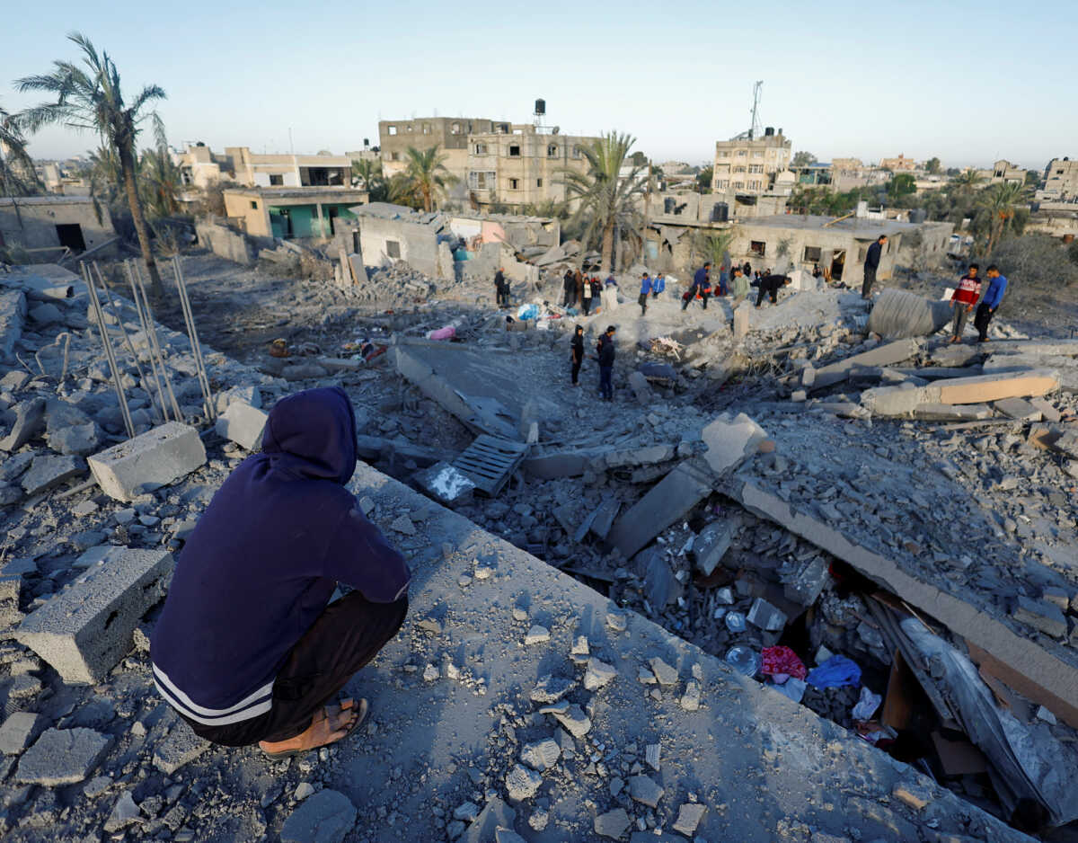 Palestinians inspect the site of an Israeli strike on a house, in Khan Younis in the southern Gaza Strip October 25, 2024. REUTERS