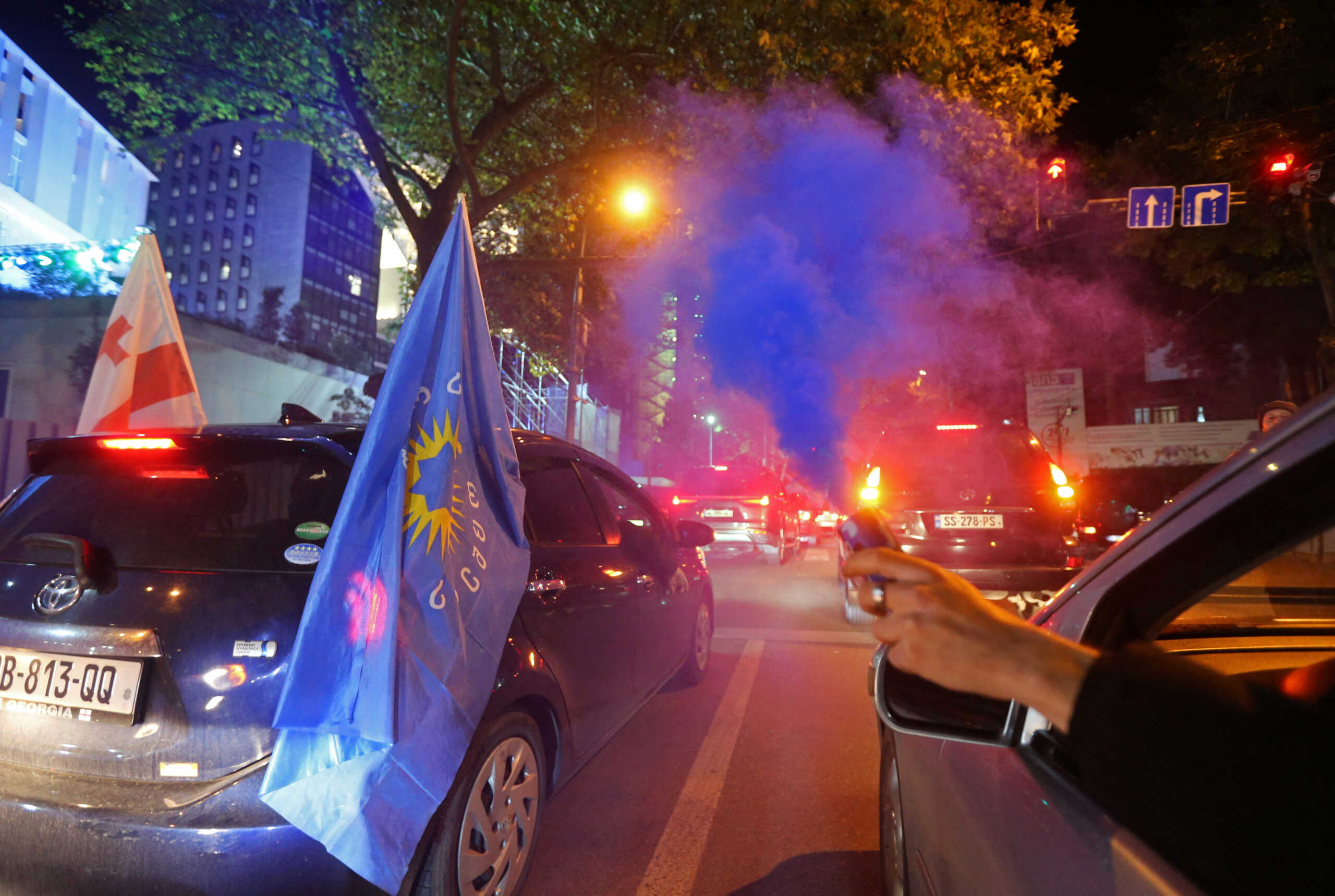 Supporters of the Georgian Dream party celebrate in the street after the announcement of exit poll results in parliamentary elections, in Tbilisi, Georgia October 26, 2024. REUTERS