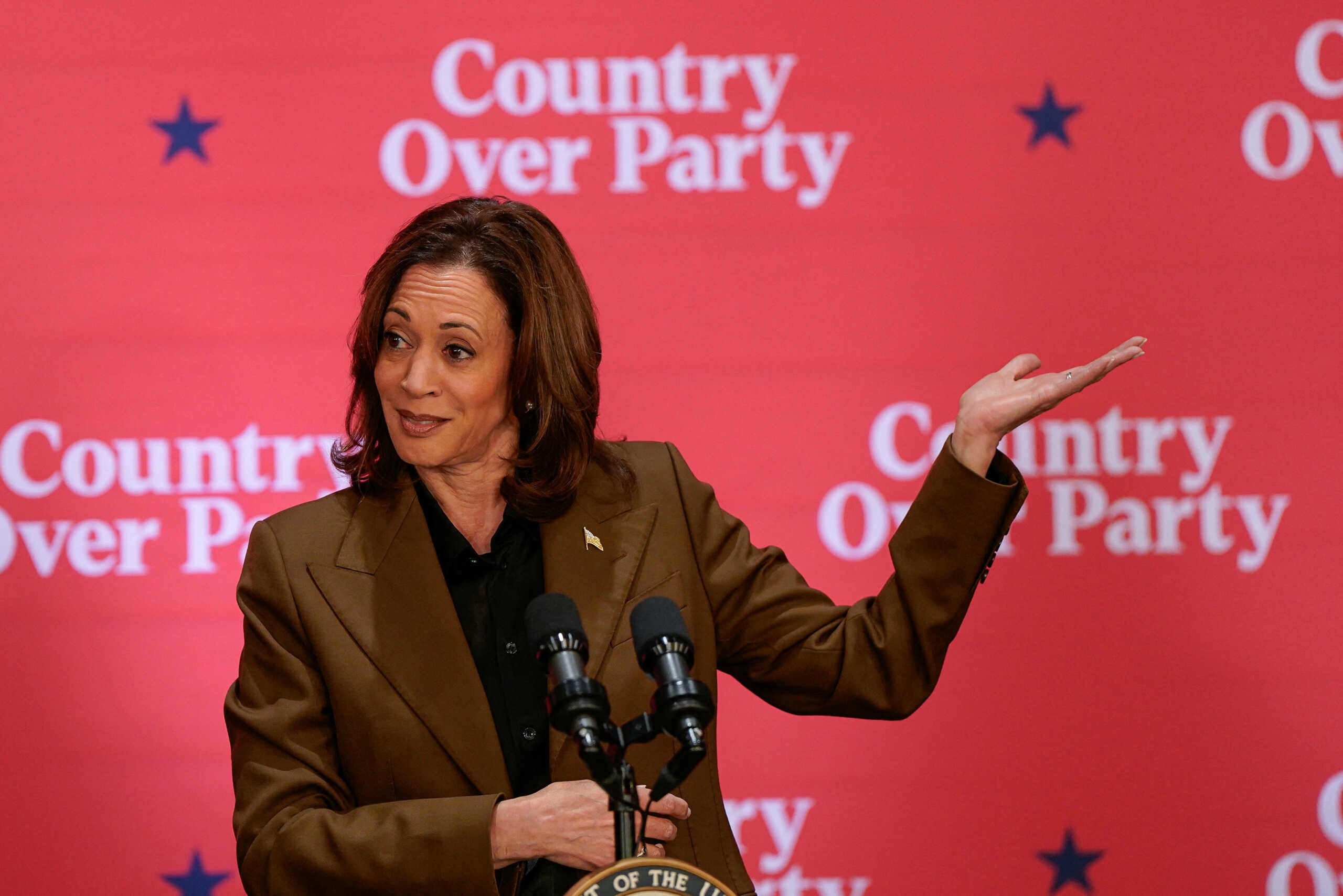 Democratic presidential nominee U.S. Vice President Kamala Harris gestures at a campaign event in Scottsdale, Arizona, U.S. October 11, 2024. REUTERS