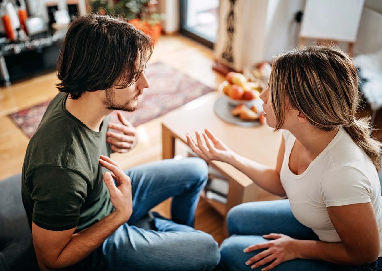 Couple have relationship issues, arguing and fighting in living room