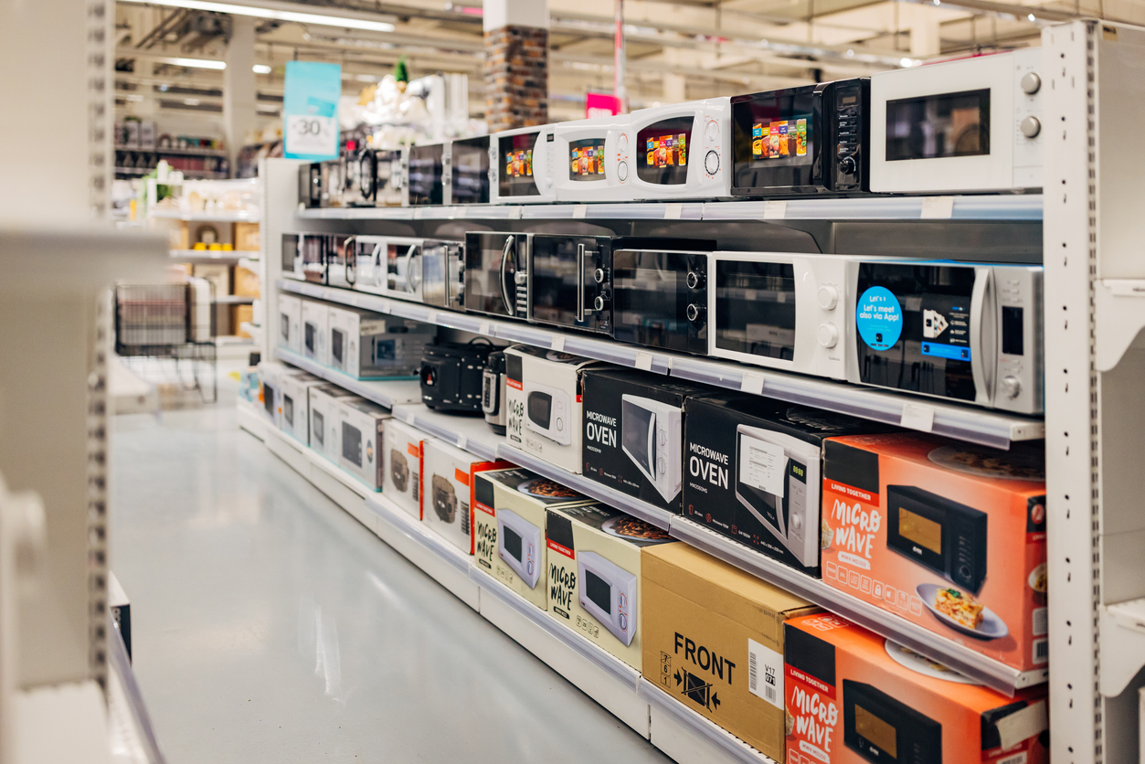 A huge selection of microwaves in the home appliance electronics store, no people