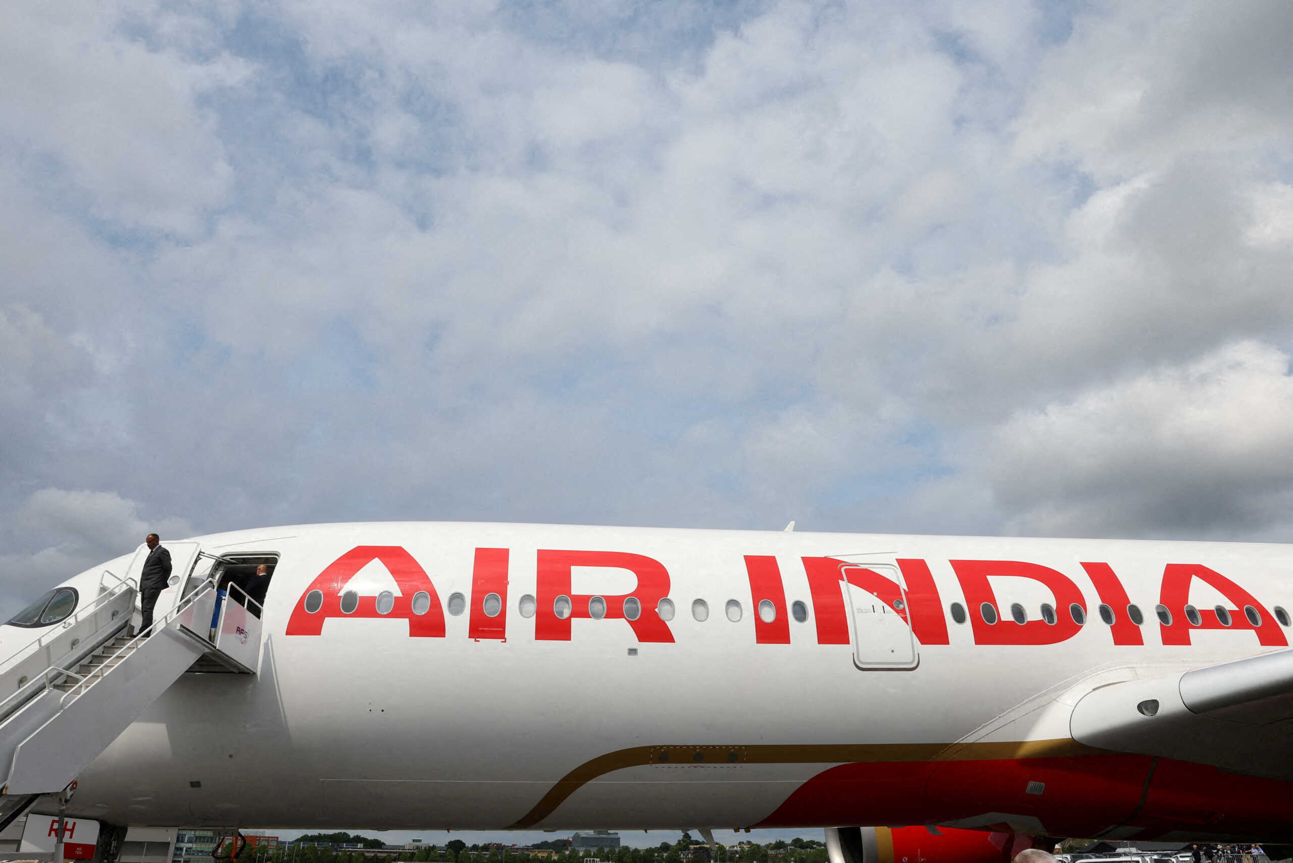 FILE PHOTO: Branding for Air India is seen on an Airbus A350-900 at the Farnborough International Airshow, in Farnborough, Britain, July 24, 2024. REUTERS