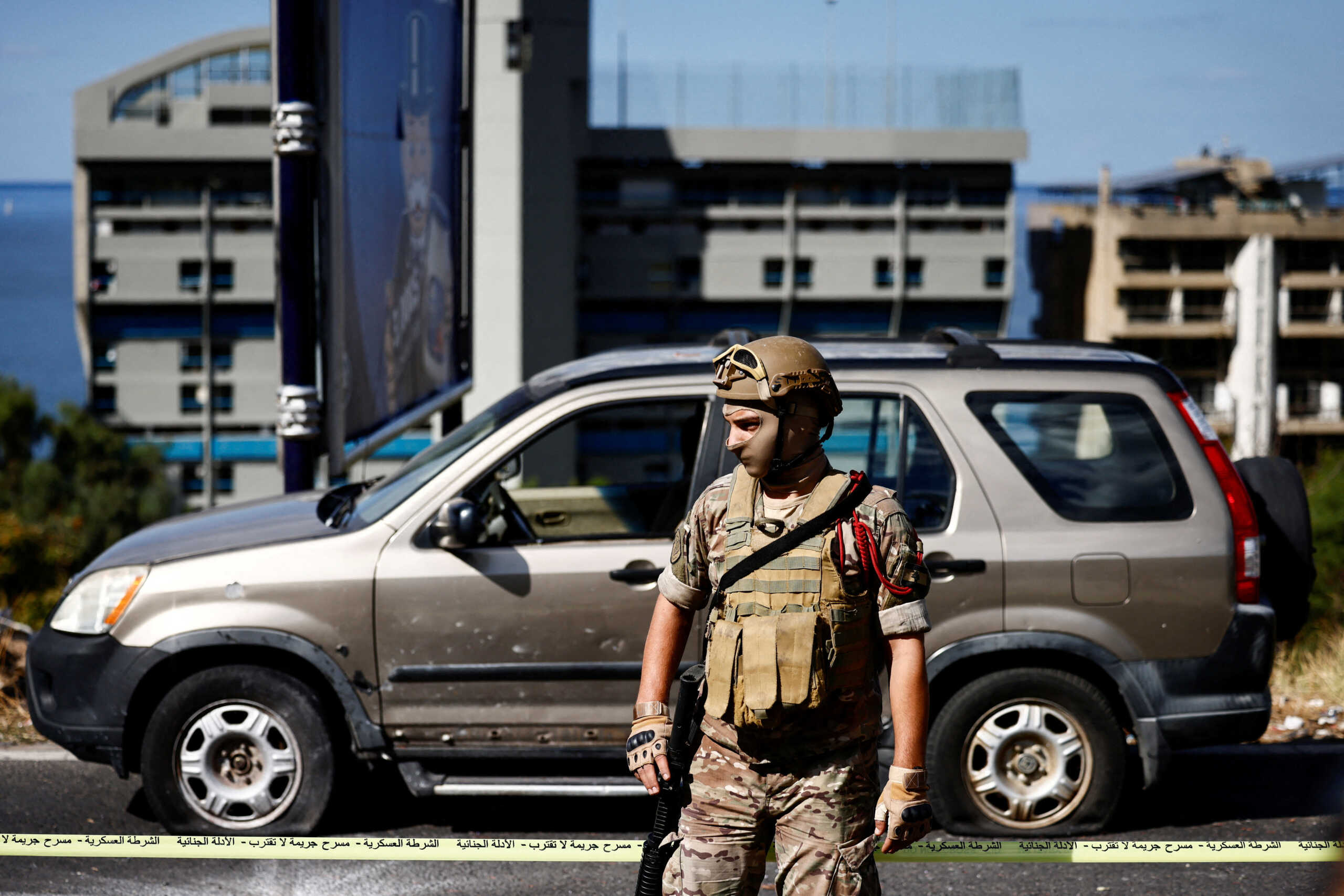 A military police looks on at the site following, what the Health Ministry says was an Israeli strike on a car, near the Christian-majority town of Jounieh, north of Beirut, Lebanon October 19, 2024. REUTERS