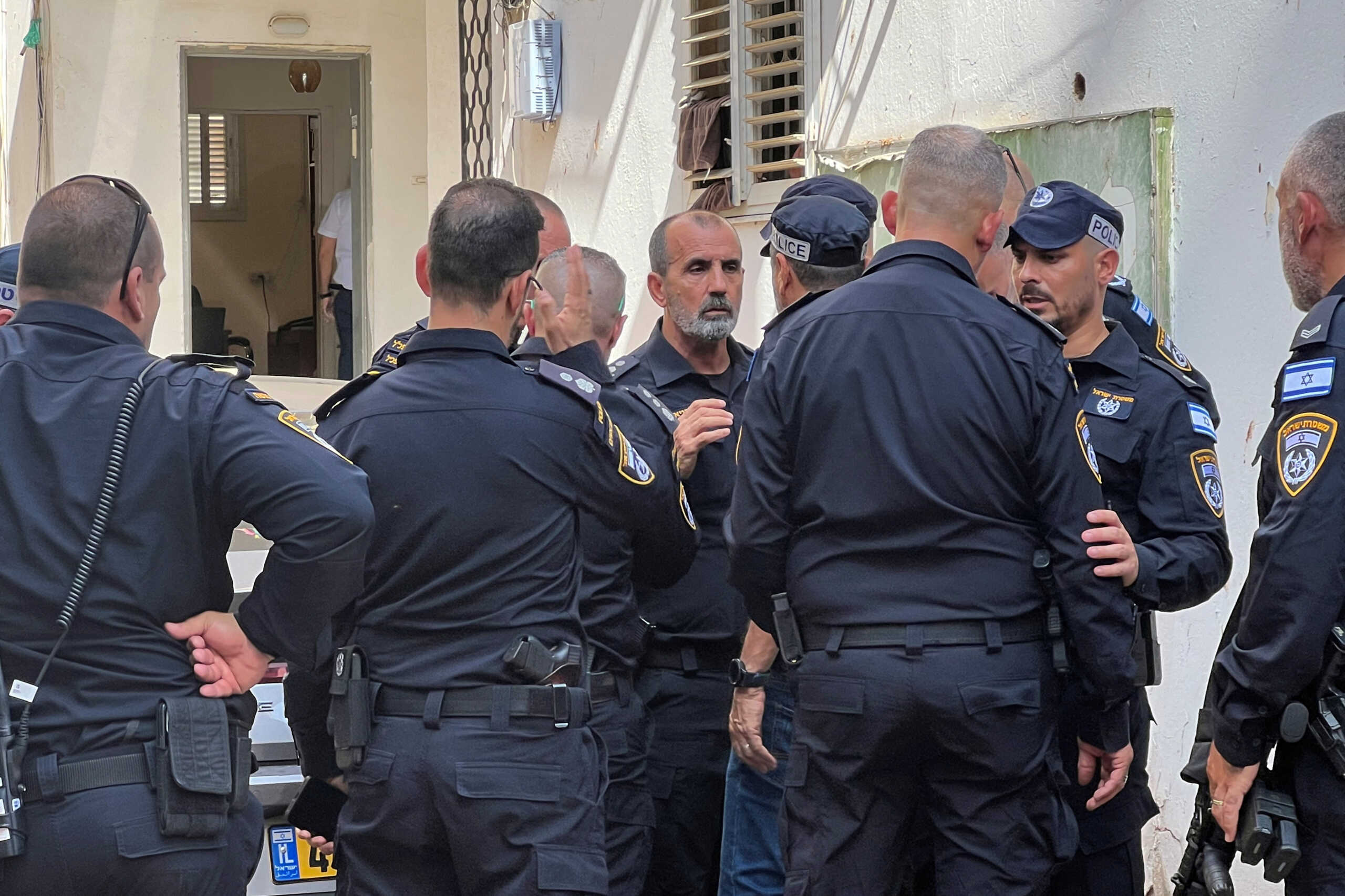 Israel Police Commissioner Daniel Levy speaks to officers at the scene of a stabbing attack in Hadera, Israel, October 9, 2024. REUTERS
