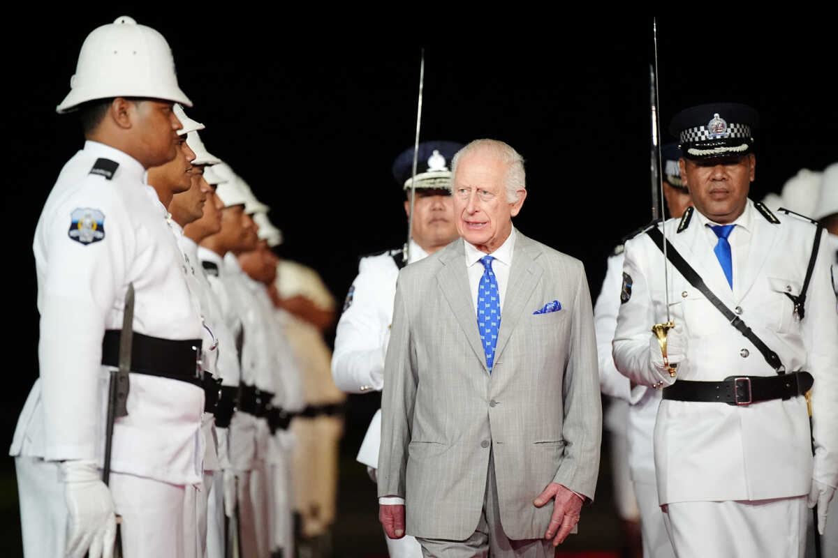 Britain's King Charles receives a guard of honour from Samoan police officers upon arrival at Faleolo International Airport in Samoa, during a visit to Australia and Samoa. Picture date: Wednesday October 23, 2024.    Aaron Chown