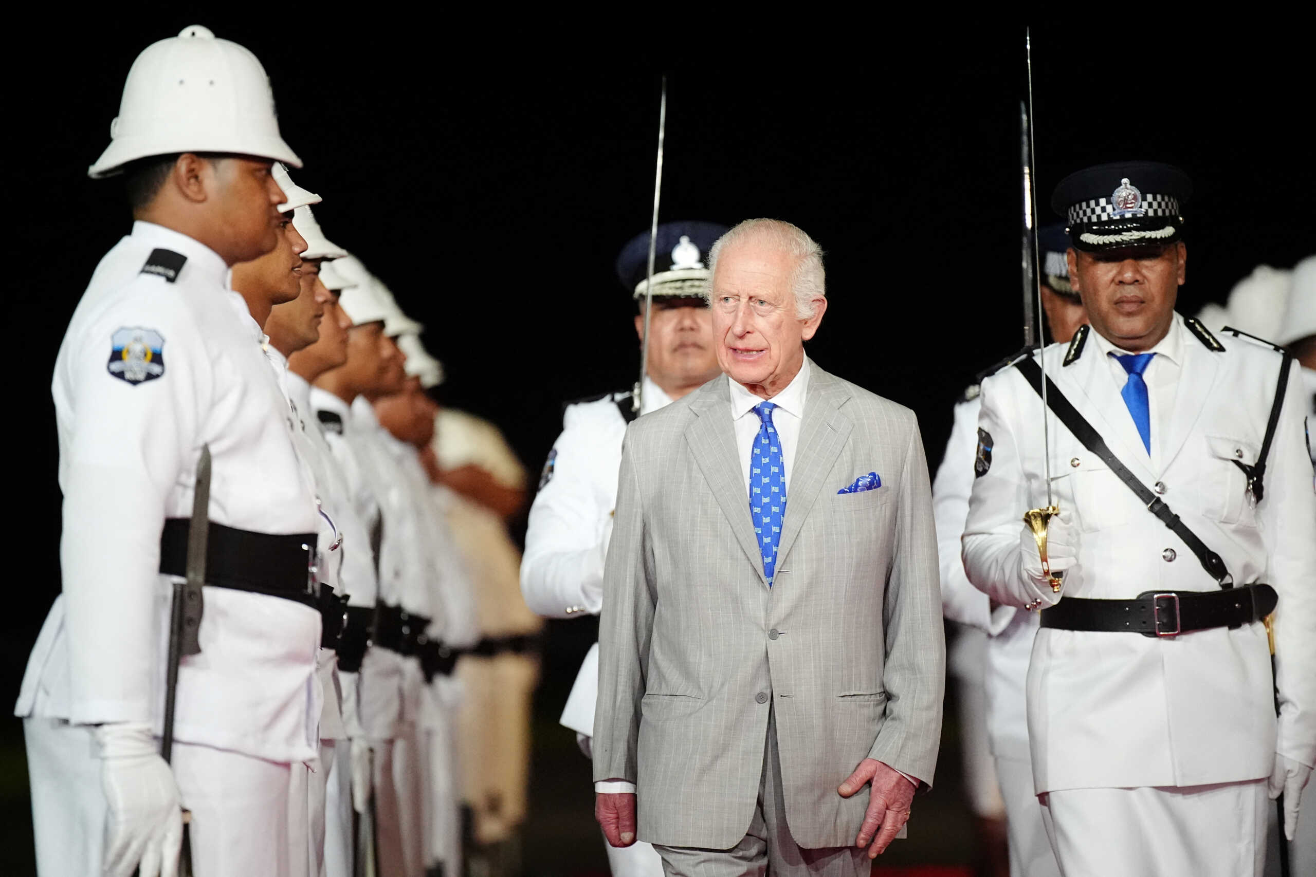 Britain's King Charles receives a guard of honour from Samoan police officers upon arrival at Faleolo International Airport in Samoa, during a visit to Australia and Samoa. Picture date: Wednesday October 23, 2024.    Aaron Chown