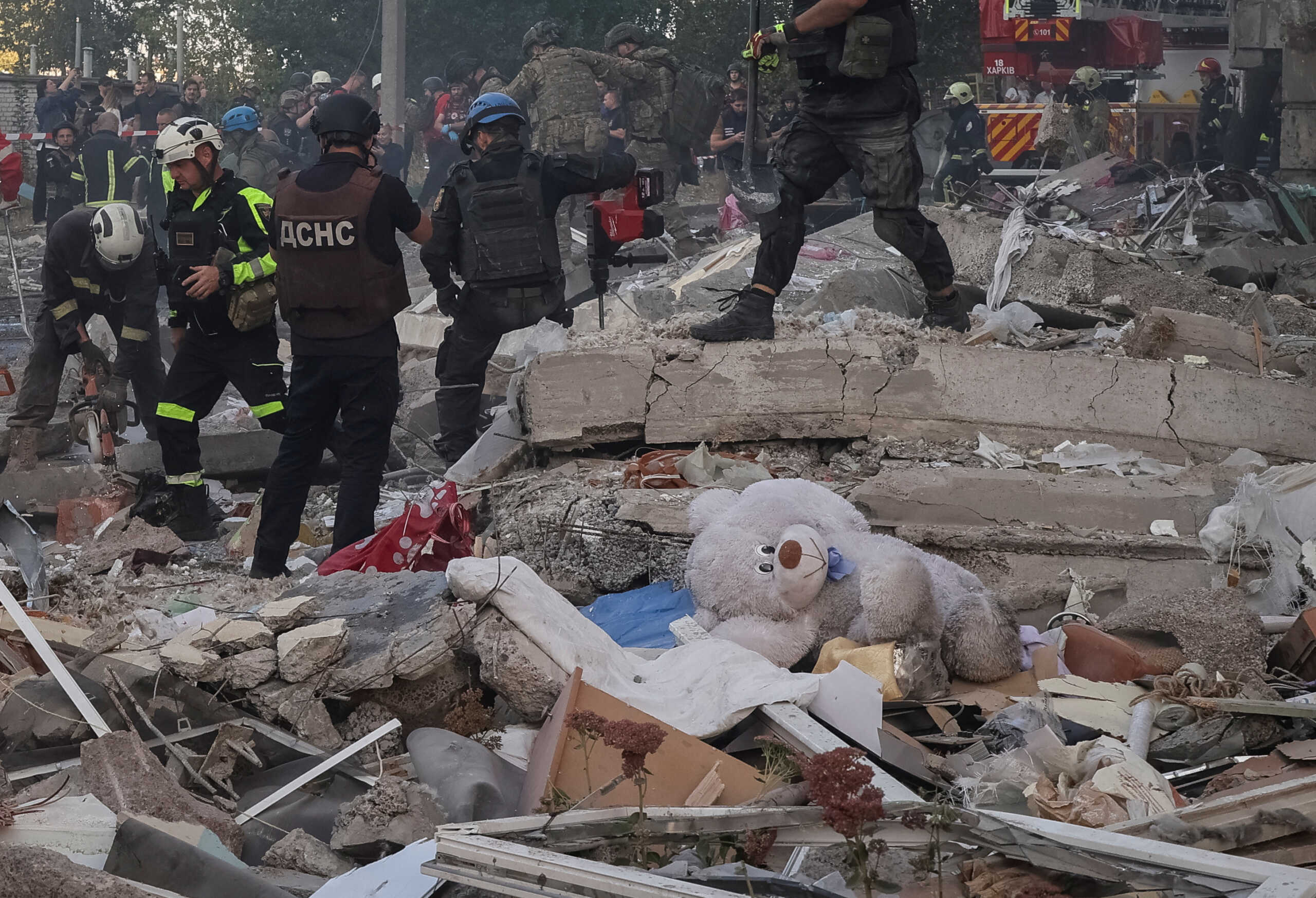 Rescuers work at the site of an apartment building hit by a Russian air strike, amid Russia's attack on Ukraine in Kharkiv, September 24, 2024. REUTERS