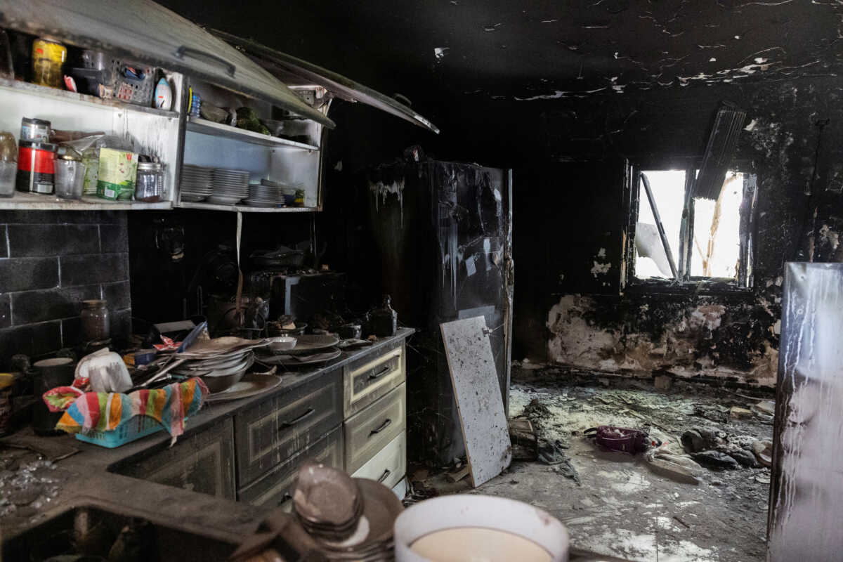 The charred remains of a kitchen are seen, nearly a year since the deadly October 7 attack by Hamas, in Kibbutz Nir Oz, southern Israel, September 30, 2024. REUTERS