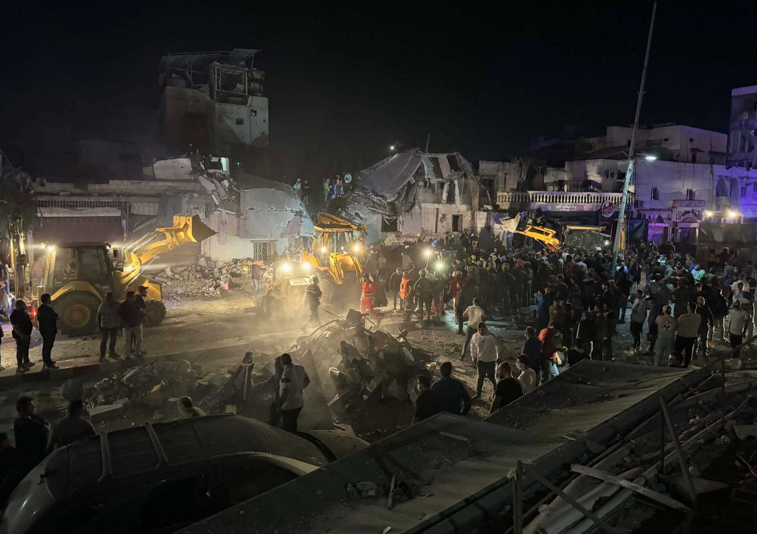 Rescuers and people gather at the site of an Israeli strike in Sidon, amid the ongoing hostilities between Hezbollah and Israeli forces, Lebanon October 29, 2024. REUTERS